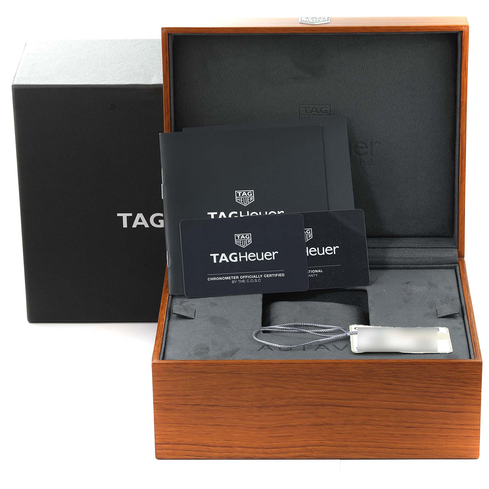 The image shows the packaging and accessories of a Tag Heuer Autavia WBE5116.EB0173 Men's Stainless Steel Blue Dial WBE5116.EB0173 Men's Stainless Steel Blue Dial watch, including a box, manual, and certification cards.