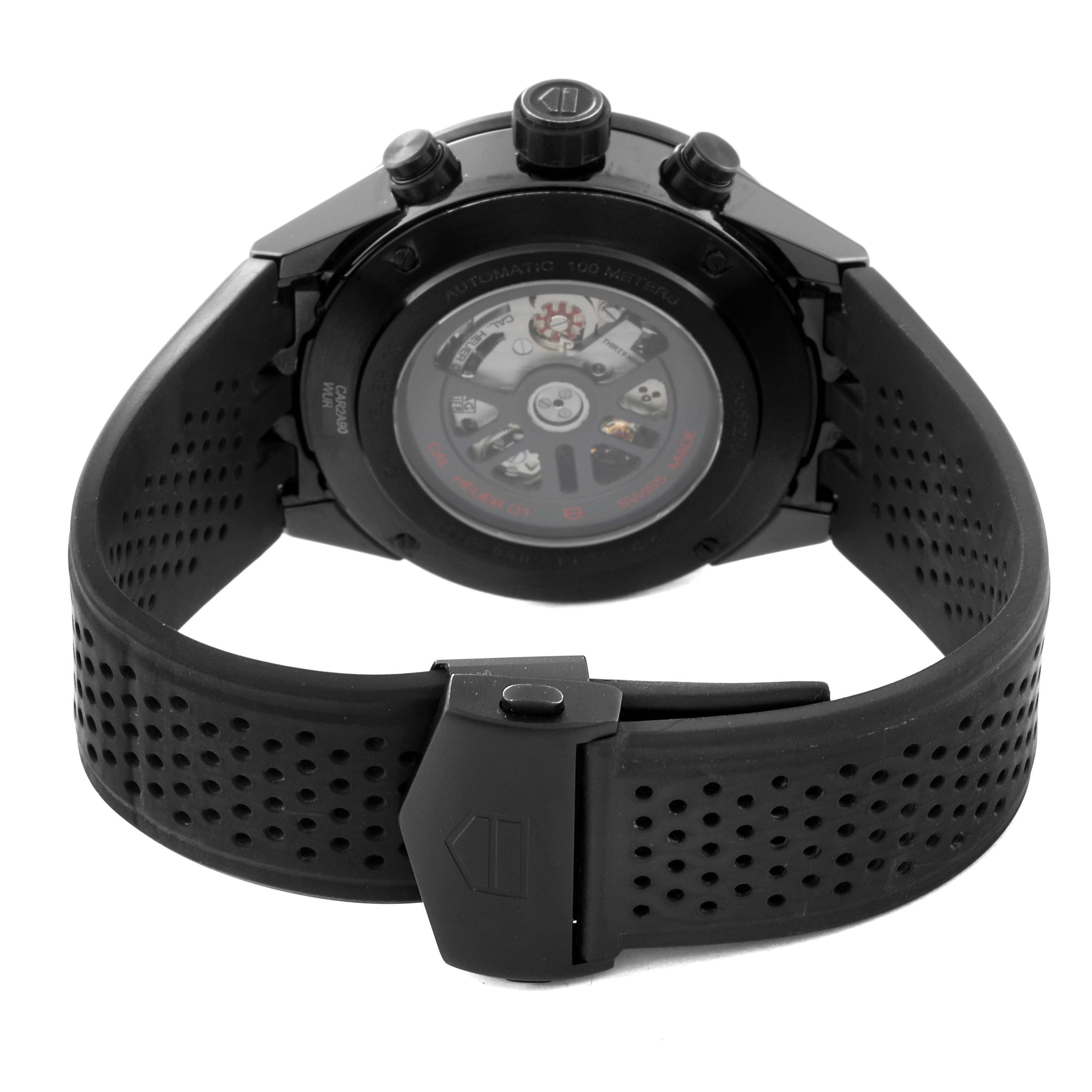 The image shows the back view of a Tag Heuer Carrera CAR2A90.FT6071 Men's Ceramic Black Dial CAR2A90.FT6071 Men's Ceramic Black Dial watch, highlighting the case back and rubber strap with a clasp.