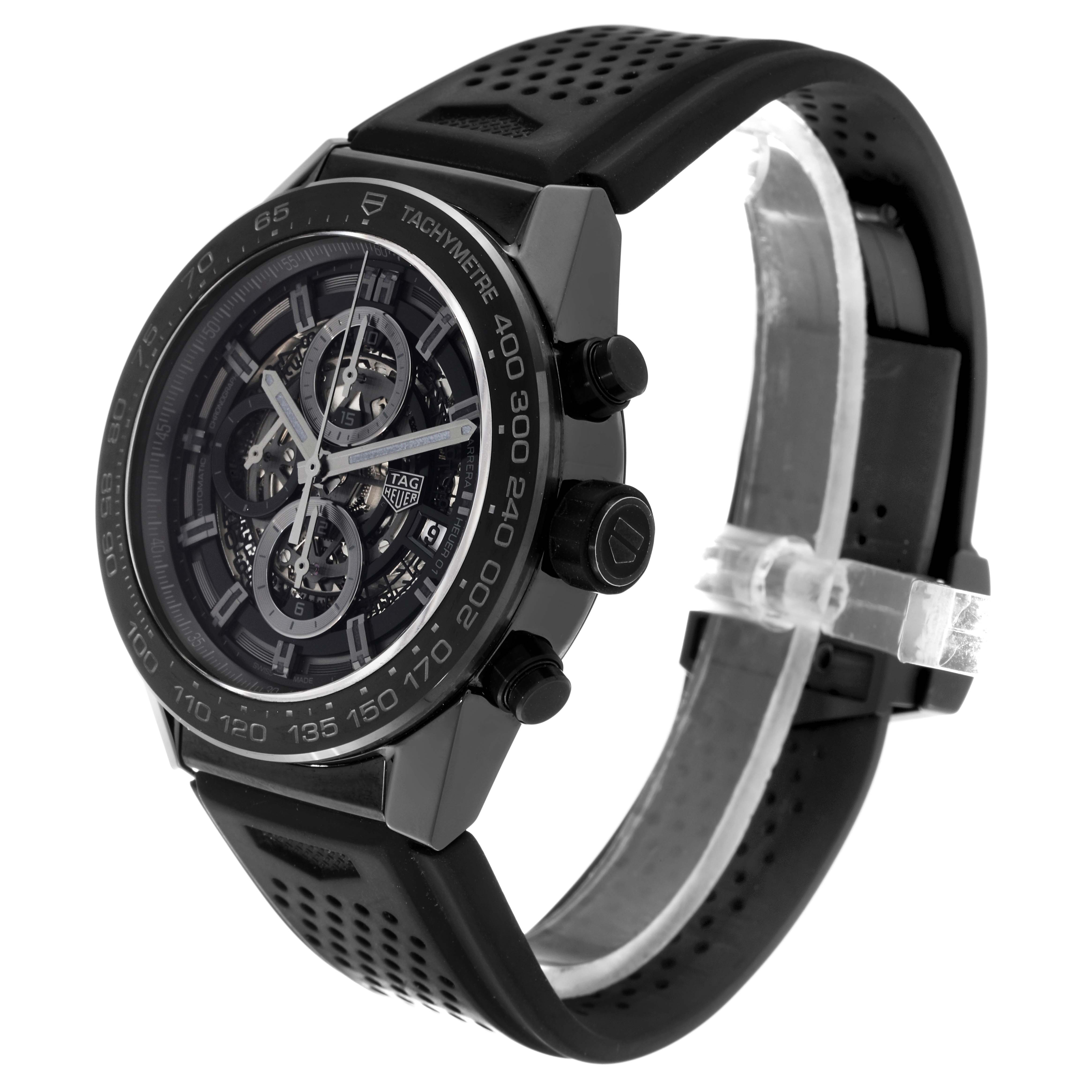 The Tag Heuer Carrera CAR2A90.FT6071 Men's Ceramic Black Dial CAR2A90.FT6071 Men's Ceramic Black Dial watch is shown at a three-quarter angle, displaying its face, tachymeter bezel, and part of the rubber strap.