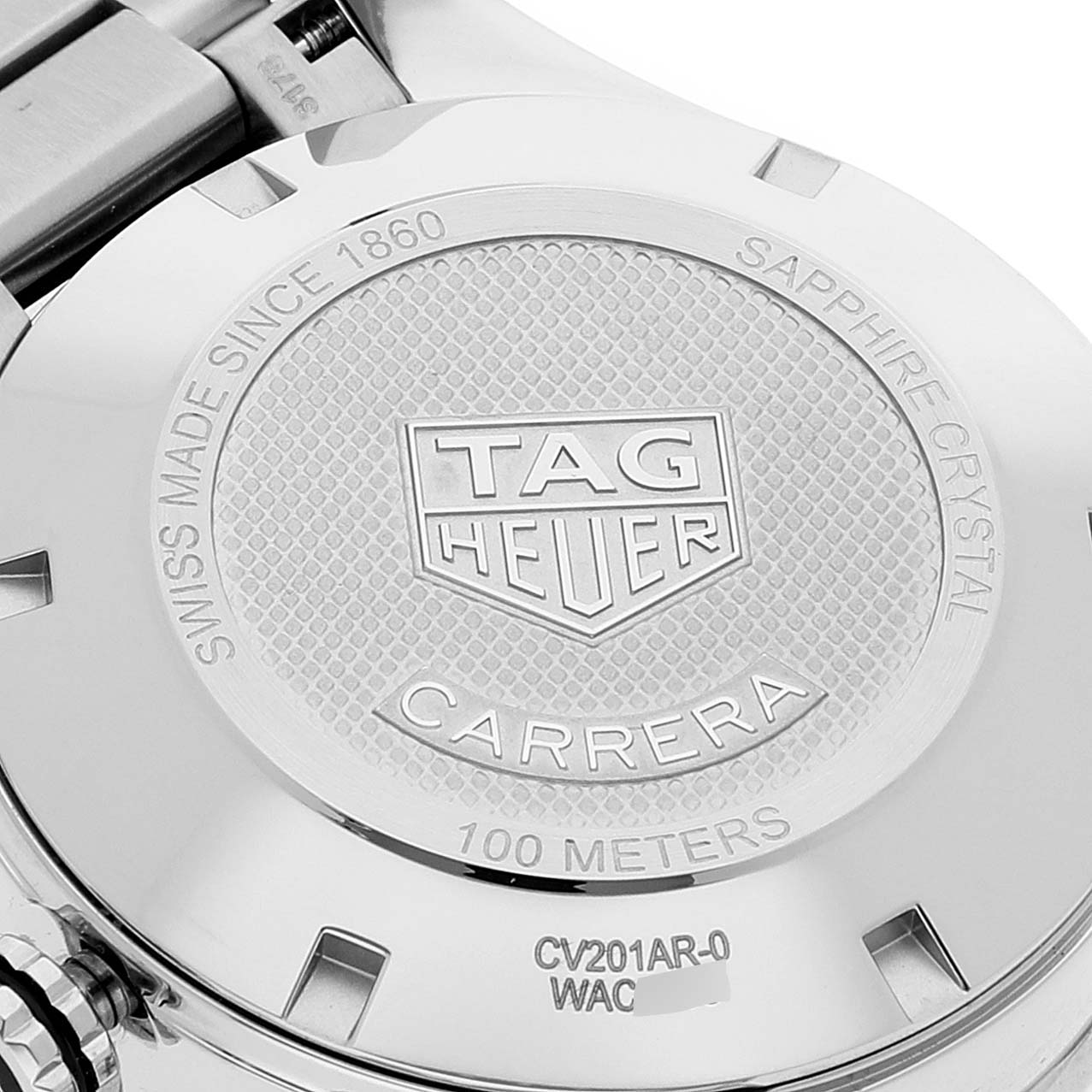The image shows the back case of a Tag Heuer Carrera CV201AR.BA0715 Men
s Stainless Steel Blue Dial CV201AR.BA0715 Men
s Stainless Steel Blue Dial watch, highlighting brand inscriptions and specifications.