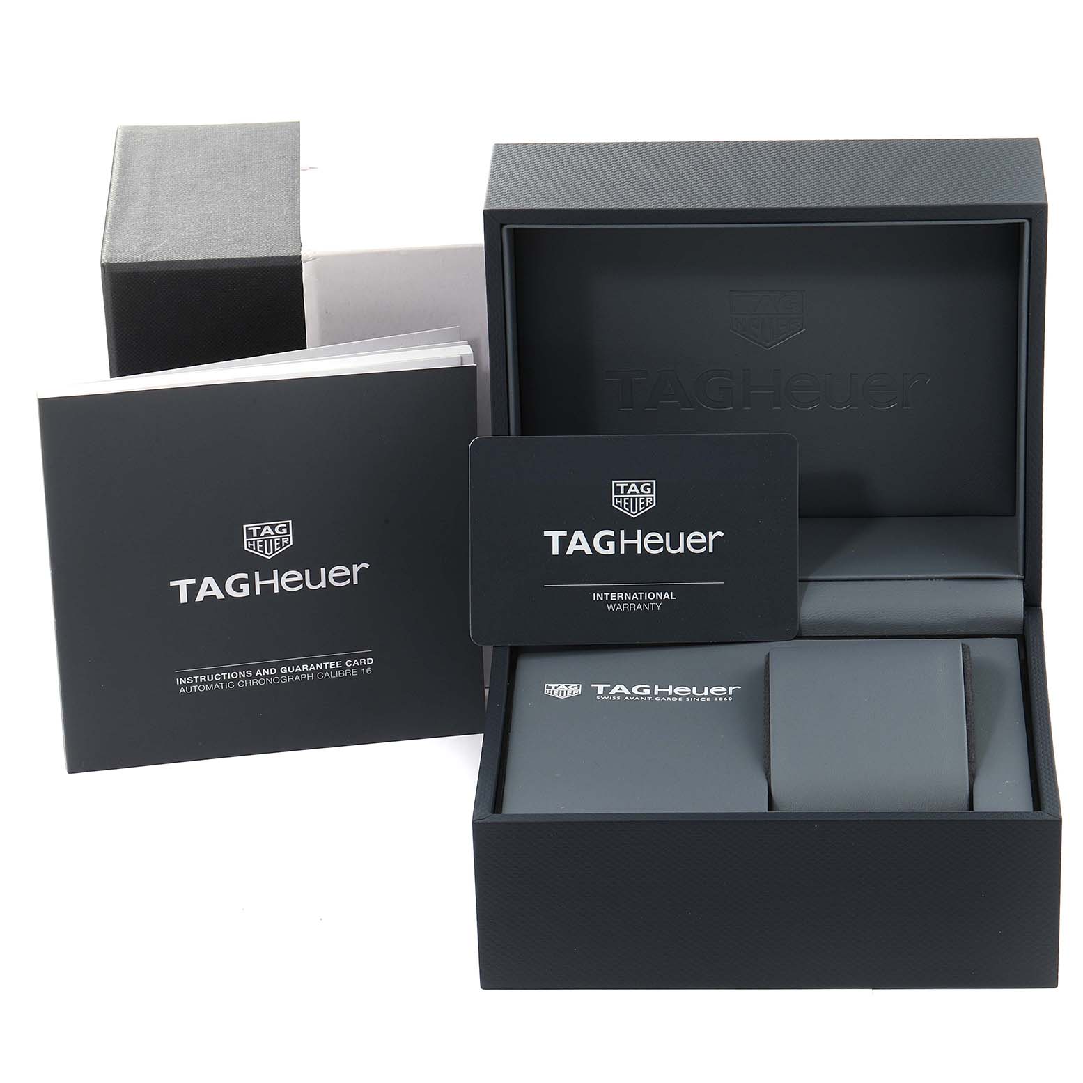 The image shows the packaging and documentation, including the warranty card and instruction manual, for a Tag Heuer Carrera CV201AR.BA0715 Men
s Stainless Steel Blue Dial CV201AR.BA0715 Men
s Stainless Steel Blue Dial model watch.