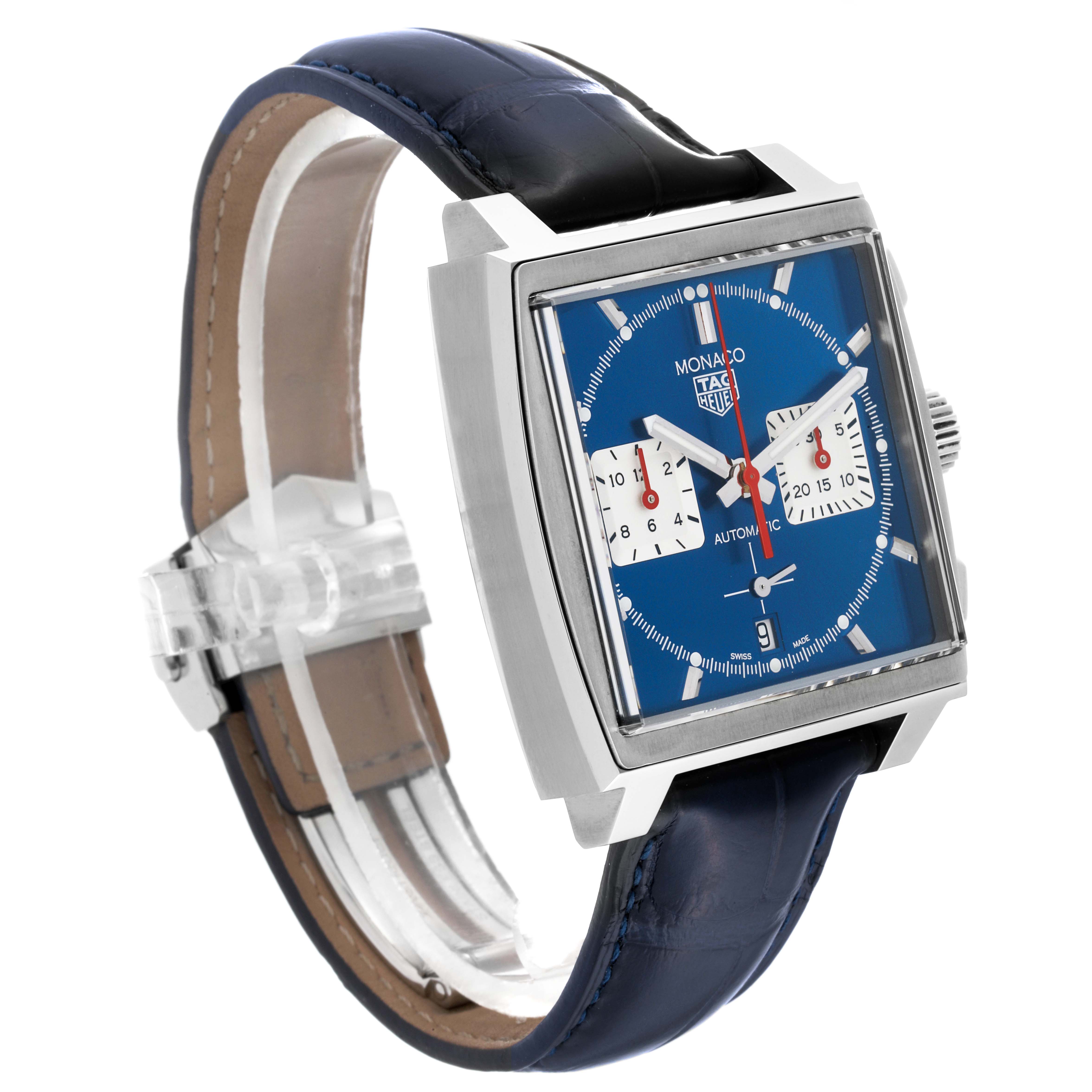 The image shows a side profile view of a Tag Heuer Monaco watch with a blue dial and leather strap.