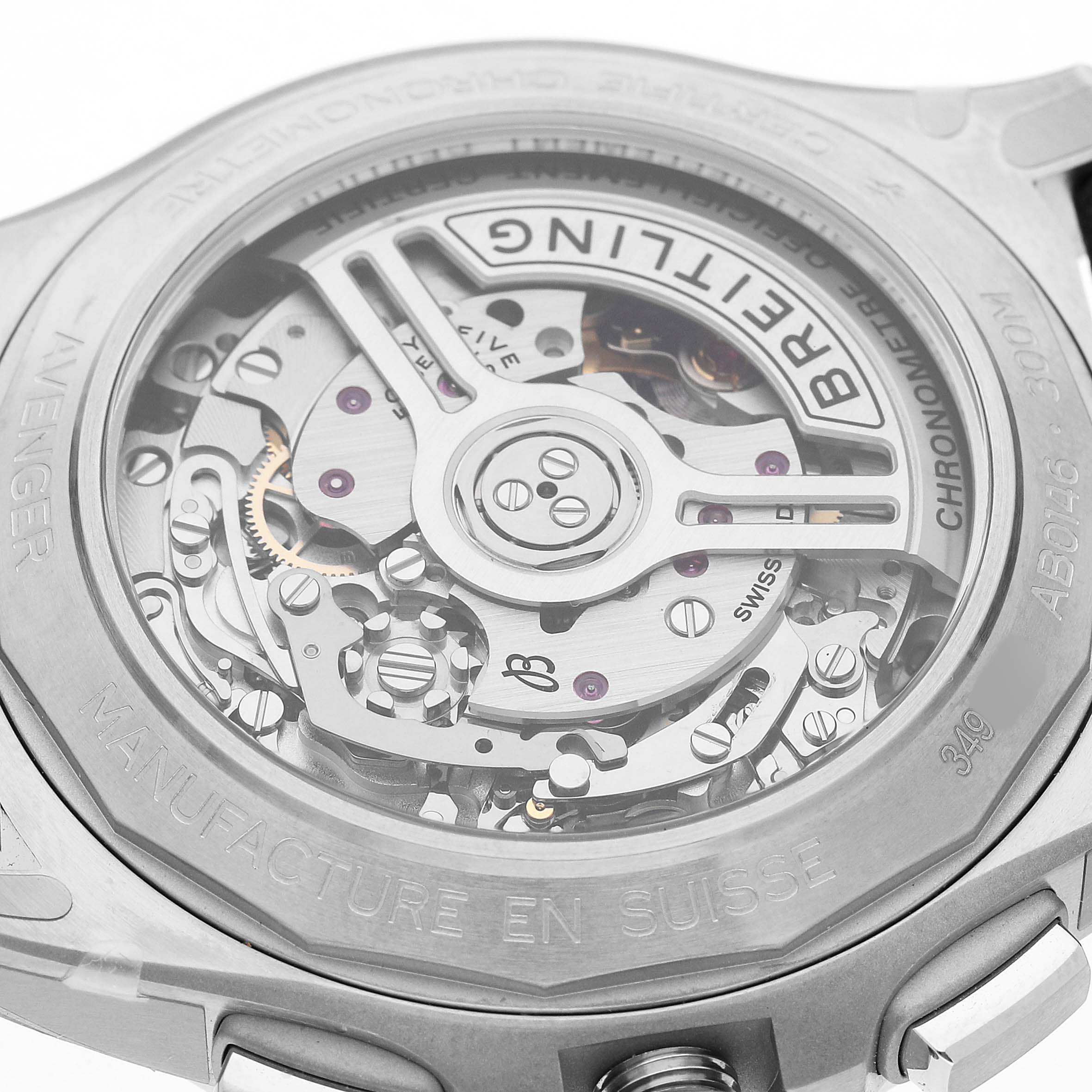 The image shows the back view of a Breitling Avenger AB0146 Men's Stainless Steel Green Dial watch, highlighting the intricate movement and engraving on the case.