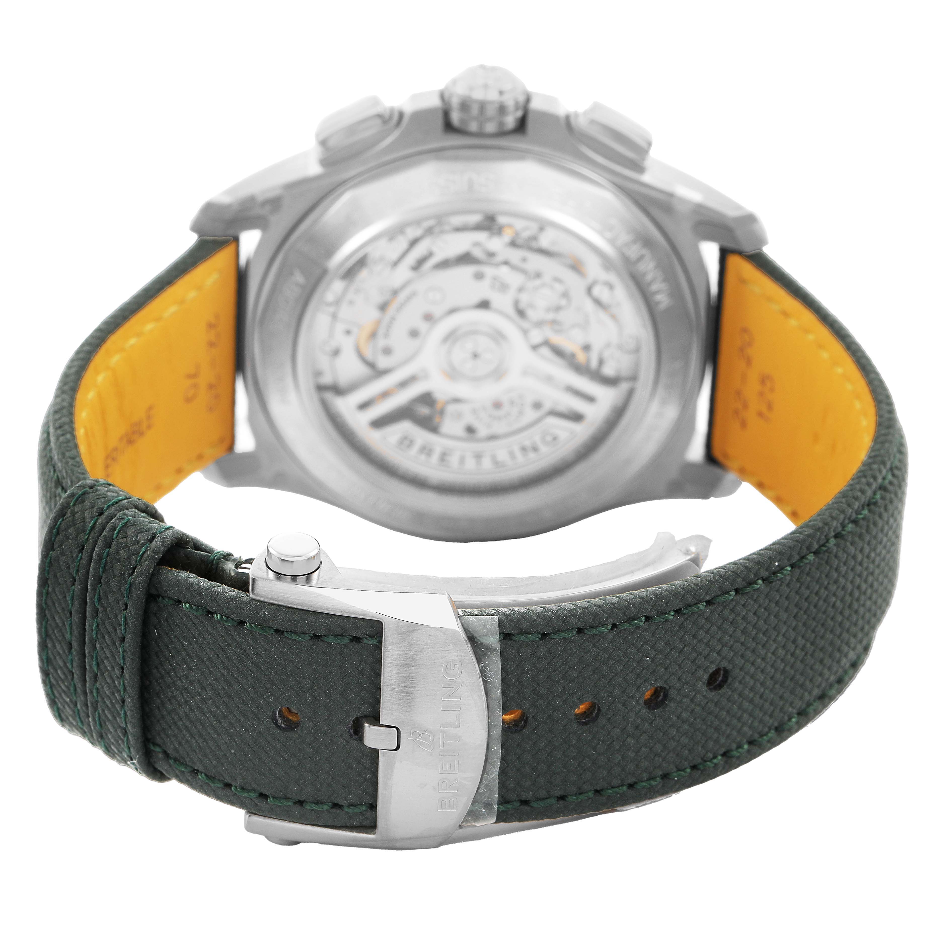 The image shows the back of a Breitling Avenger AB0146 Men's Stainless Steel Green Dial watch, highlighting the transparent case back and the green strap with a clasp.
