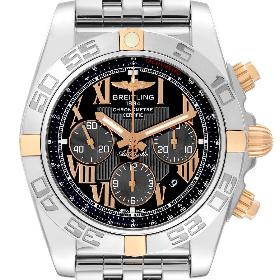 The image shows a front view of the Breitling Chronomat watch, featuring a metal bracelet, tachymeter, and chronograph subdials.