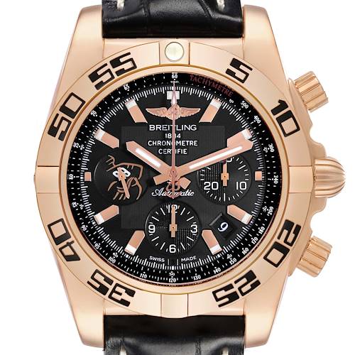 The Breitling Chronomat watch is shown from the front, highlighting the dial, bezel, and crown, with a leather strap visible.