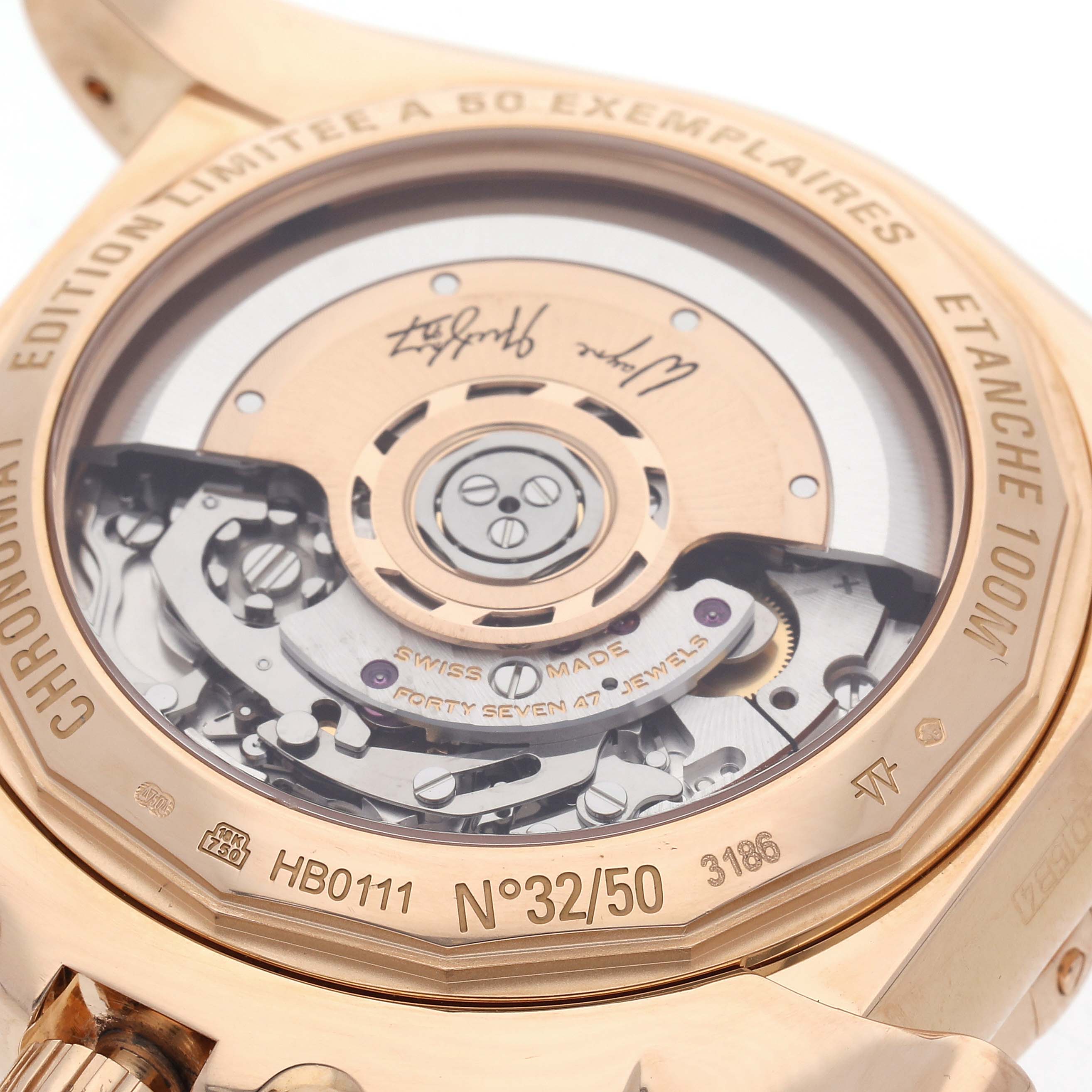 The image shows the back of a Breitling Chronomat HB01115W/BE53 Men
s Rose Gold Black Dial HB01115W/BE53 Men
s Rose Gold Black Dial, revealing the movement and limited edition engraving.