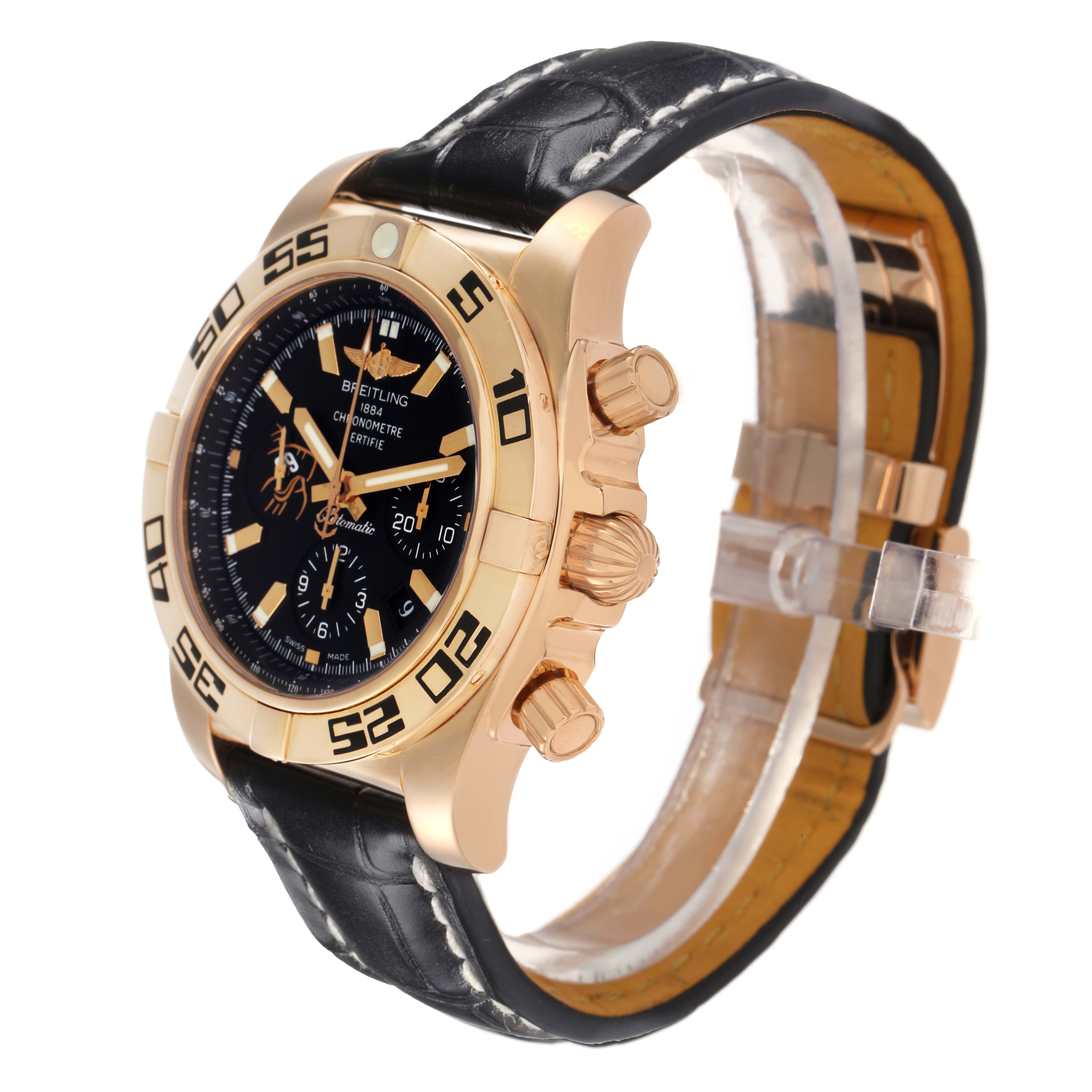 The Breitling Chronomat HB01115W/BE53 Men
s Rose Gold Black Dial HB01115W/BE53 Men
s Rose Gold Black Dial watch is shown at a three-quarter angle, highlighting the gold case, black dial, crown, and leather strap.