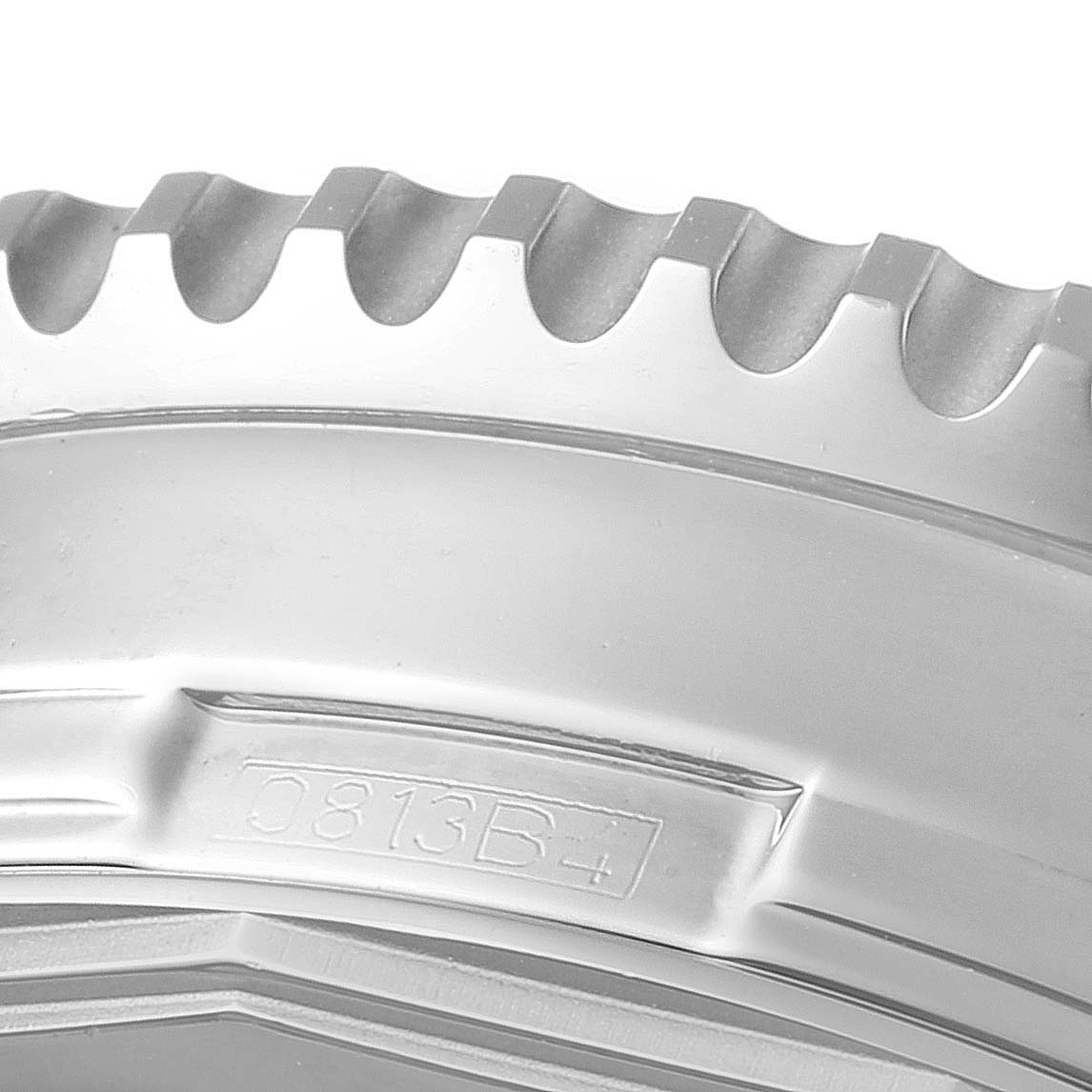 This is a close-up image of the bezel and case edge of a Breitling Navitimer A24322 Men
s Stainless Steel Silver Dial A24322 Men
s Stainless Steel Silver Dial watch, showing teeth-like detailing and model inscription.