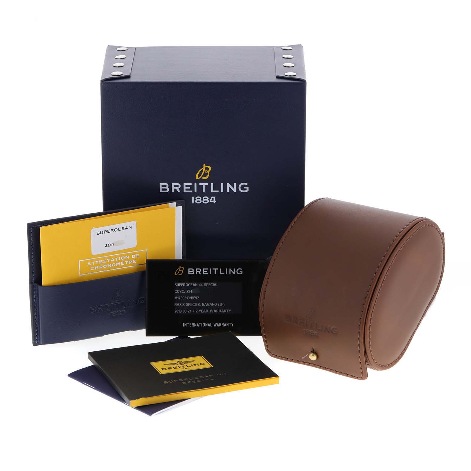 The image shows the packaging and accessories for the Breitling Superocean M17393 Men
s Stainless Steel Black Dial M17393 Men
s Stainless Steel Black Dial model, including box, watch case, and documents.