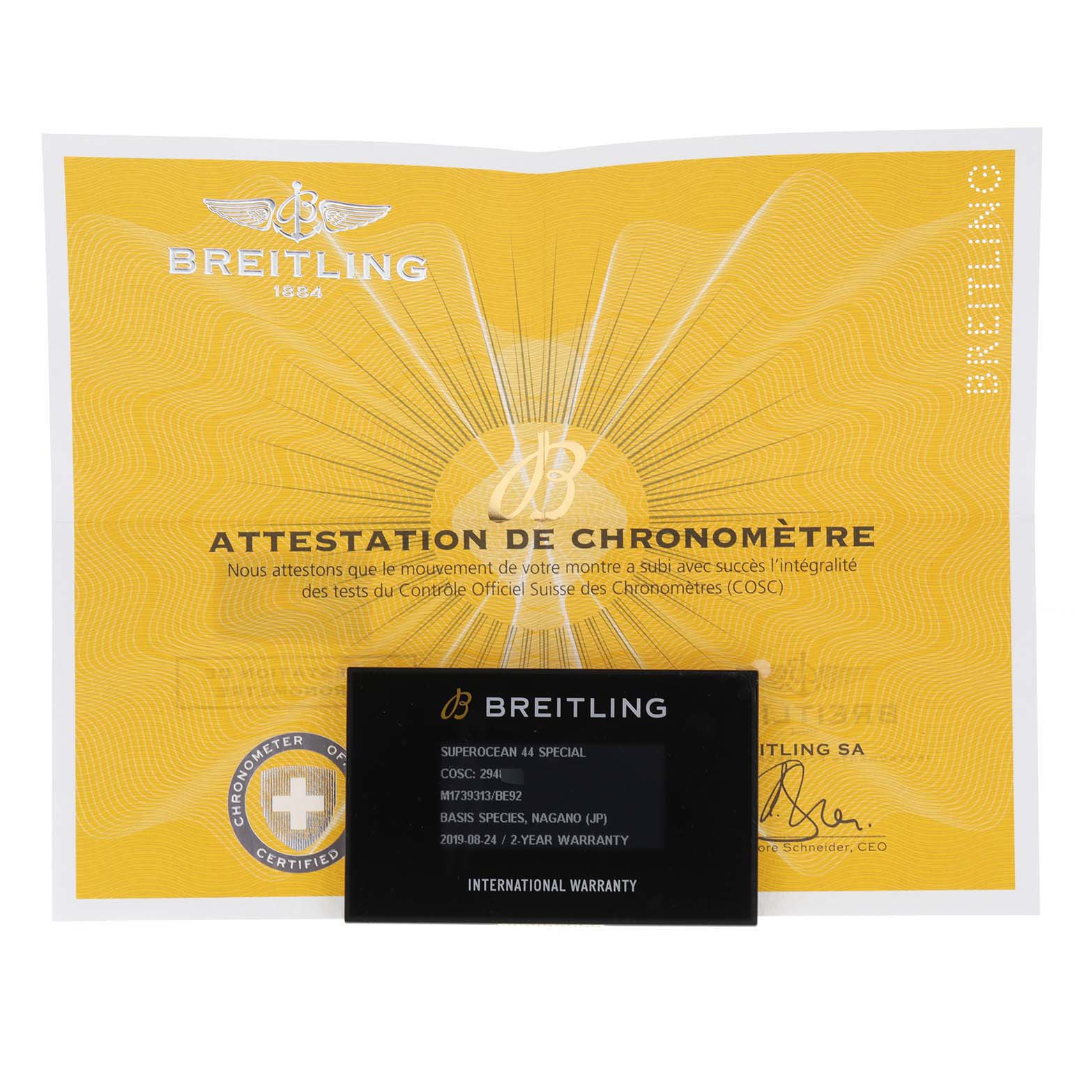 The image shows the warranty card and chronometer certificate for a Breitling Superocean M17393 Men
s Stainless Steel Black Dial M17393 Men
s Stainless Steel Black Dial model.