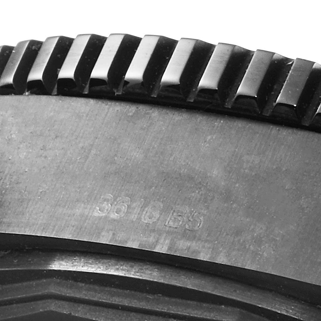 The image shows a close-up of the bezel edge and part of the case of a Breitling Superocean M17393 Men
s Stainless Steel Black Dial M17393 Men
s Stainless Steel Black Dial watch.