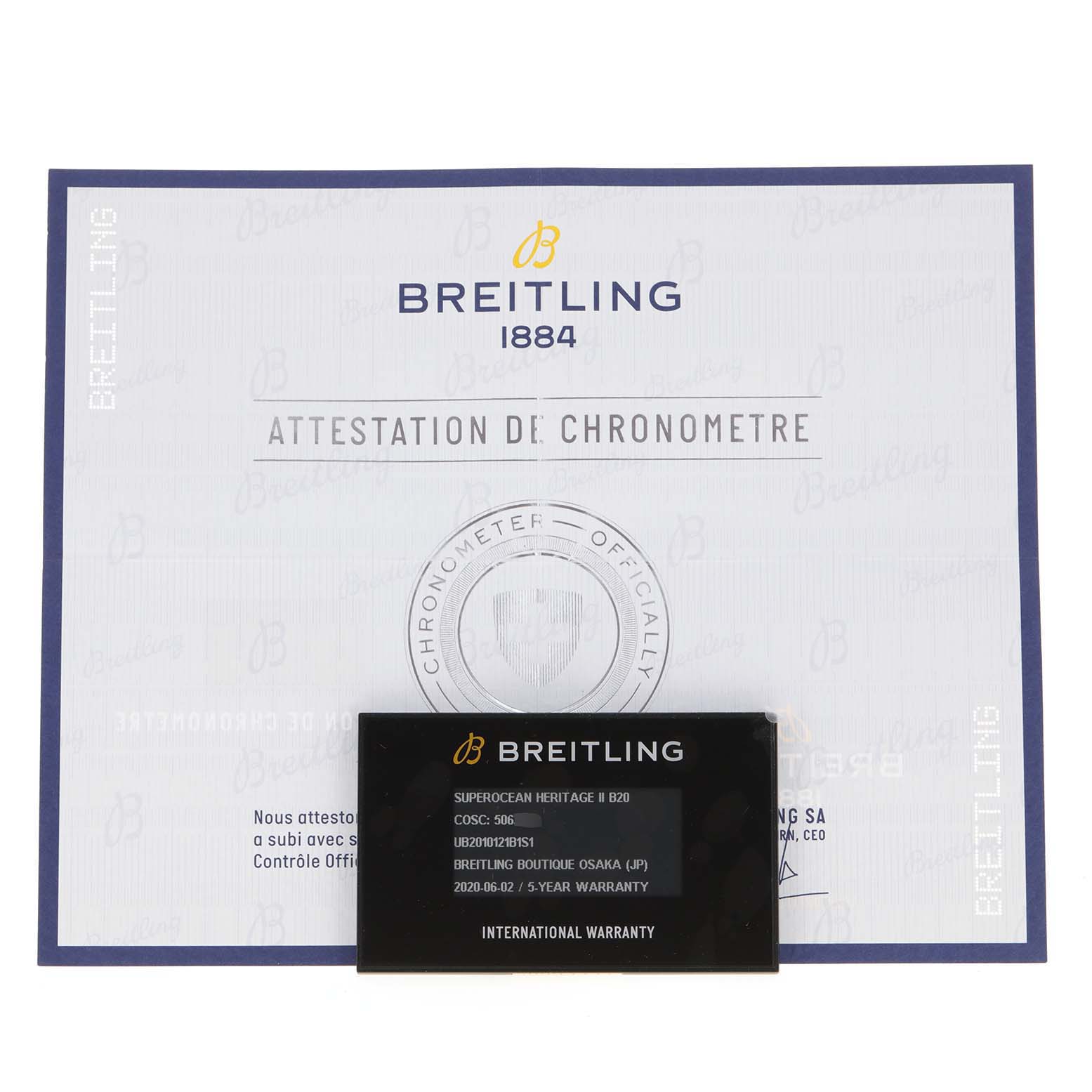 The image shows the warranty card and chronometer certificate for a Breitling Superocean UB201012/BG53/154A Men
s Stainless Steel Black Dial UB201012/BG53/154A Men
s Stainless Steel Black Dial watch.