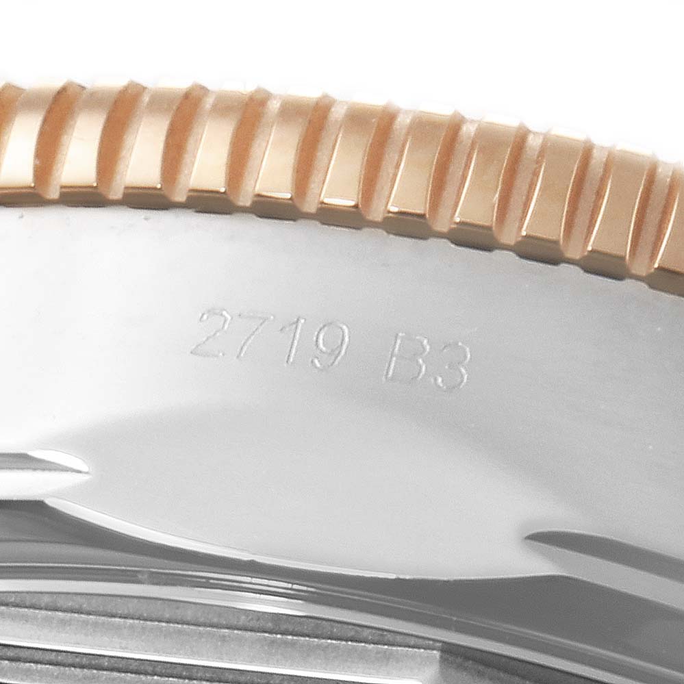 The image shows a close-up of the bezel and part of the case with an engraved serial number on a Breitling Superocean UB201012/BG53/154A Men
s Stainless Steel Black Dial UB201012/BG53/154A Men
s Stainless Steel Black Dial watch.