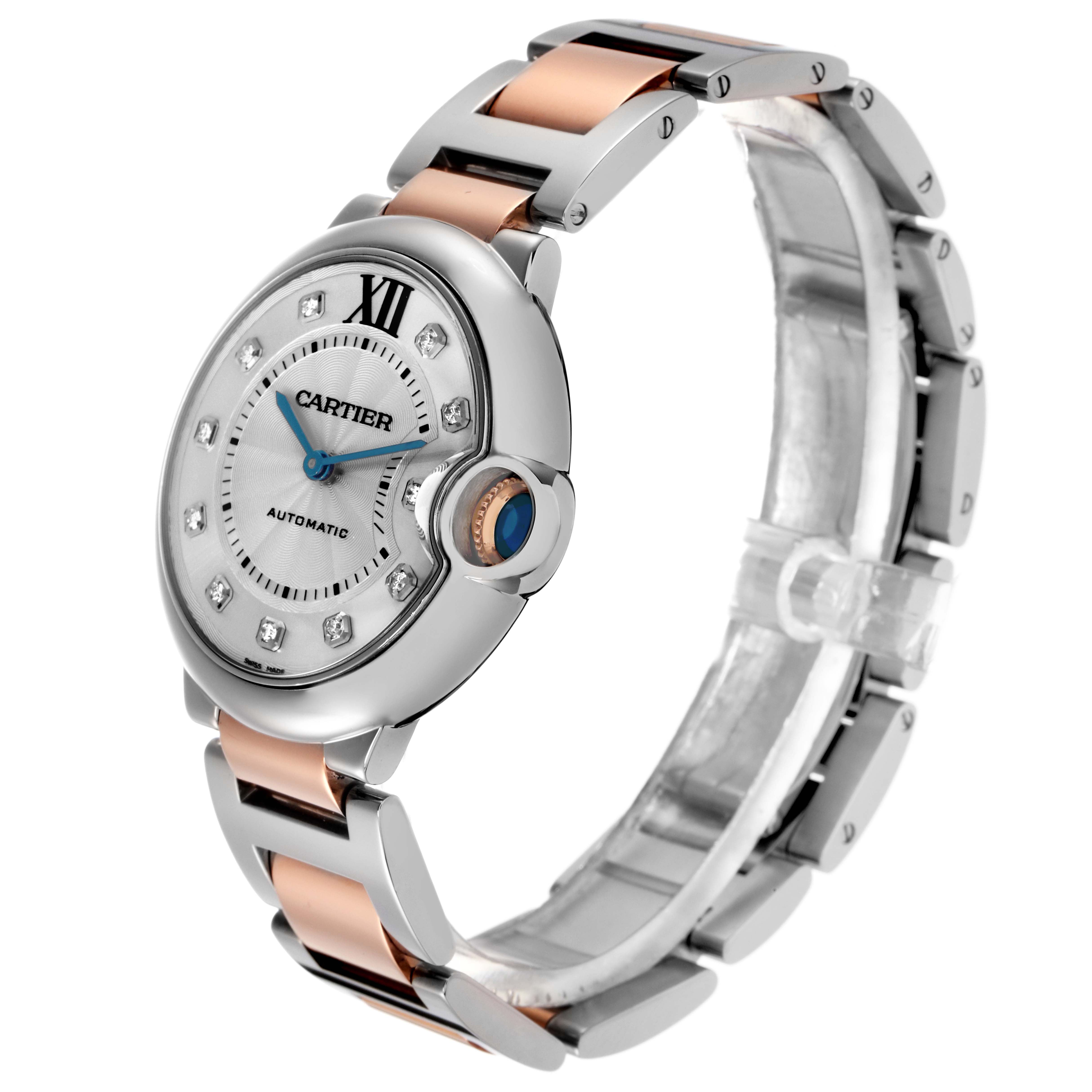 The Ballon Bleu by Cartier is shown at a three-quarter angle, highlighting the round case, bracelet, blue cabochon crown, and dial details.