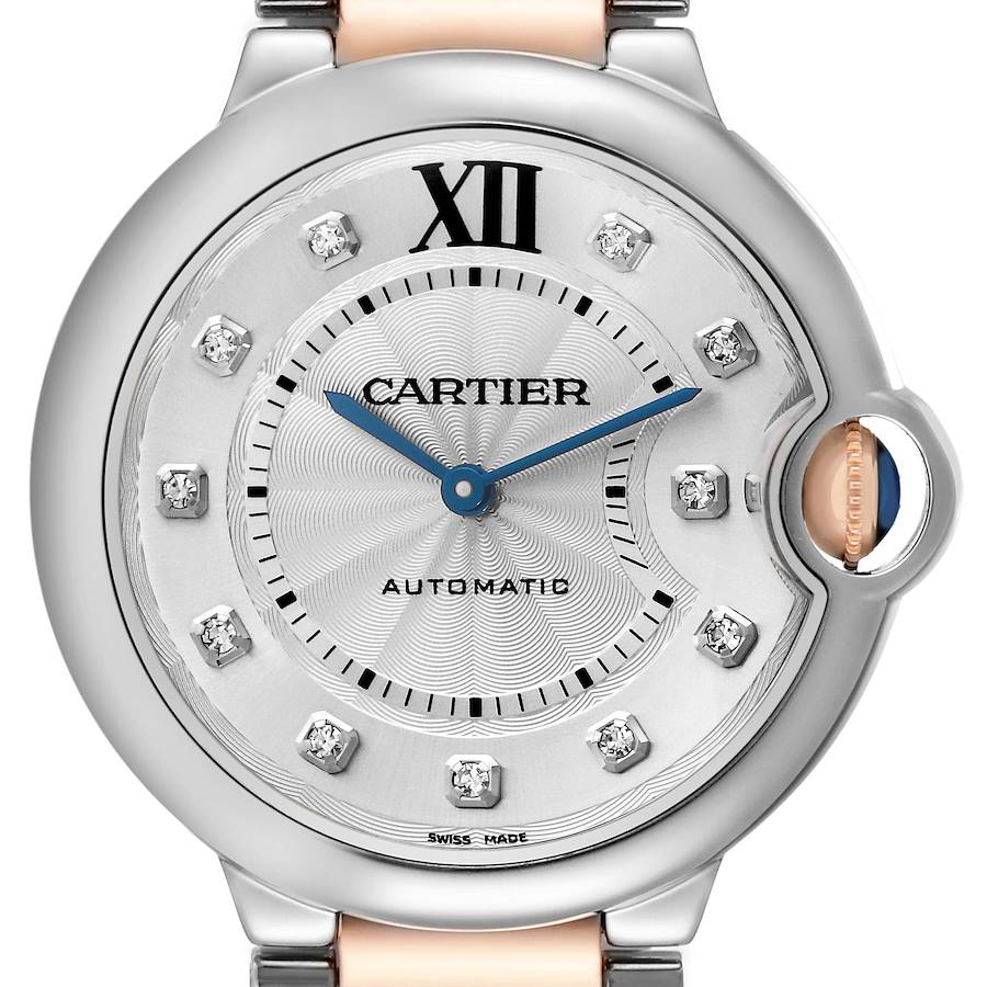 The image shows a close-up of the Cartier Ballon Bleu watch face, highlighting the Roman numeral XII, diamond markers, and the crown.