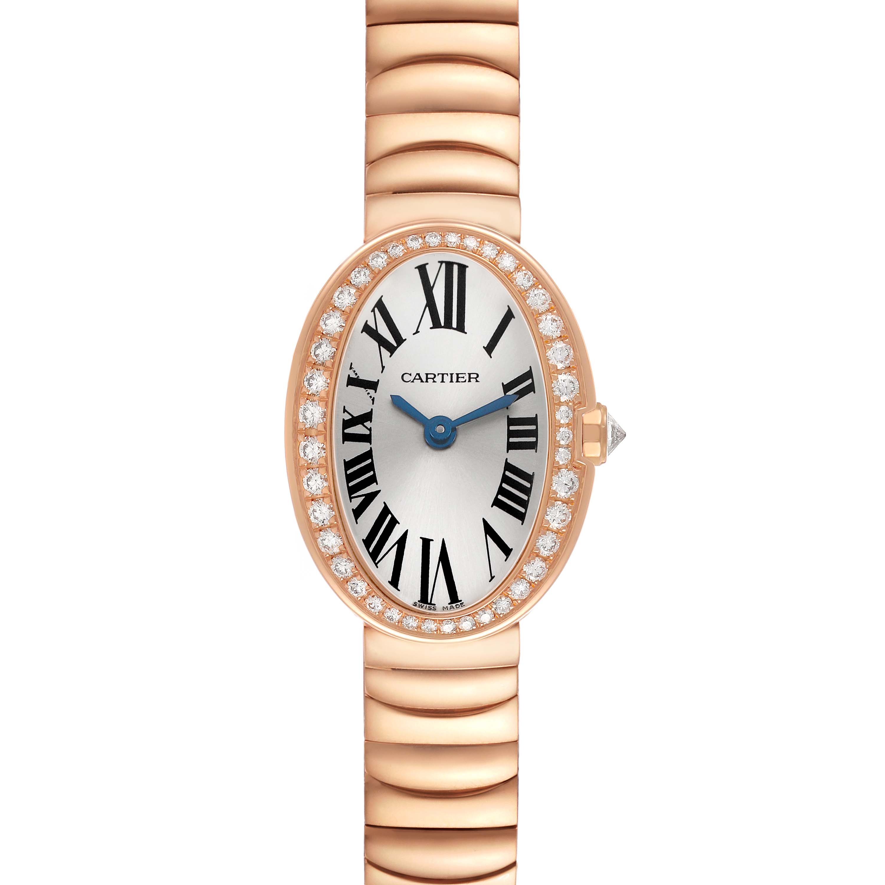The Cartier Baignoire WB520026 Women's Rose Gold Silver Dial watch is shown from the front, highlighting its oval face, Roman numerals, diamond bezel, and gold bracelet.