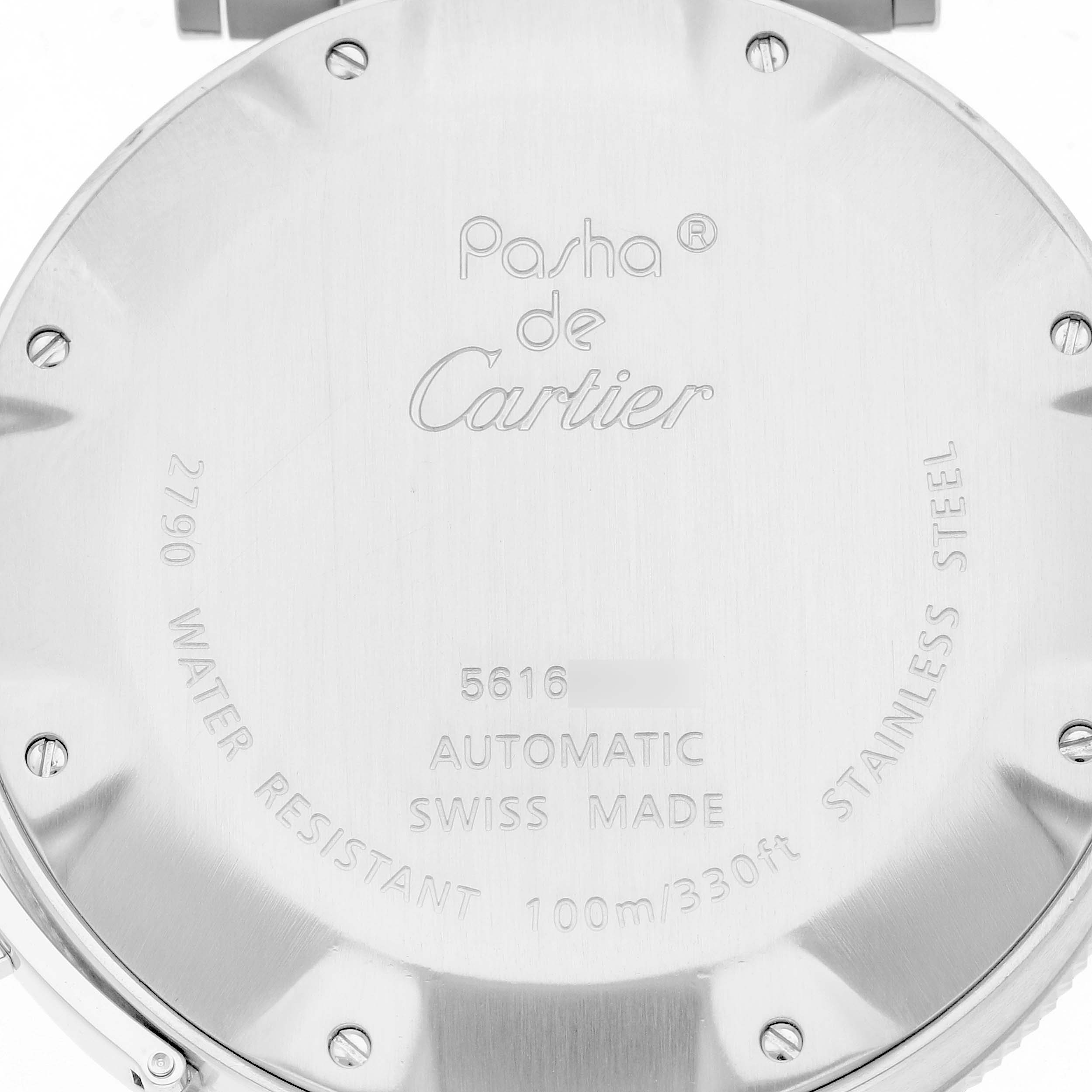 The image shows the back case of a Pasha de Cartier watch, featuring engravings and screw details.