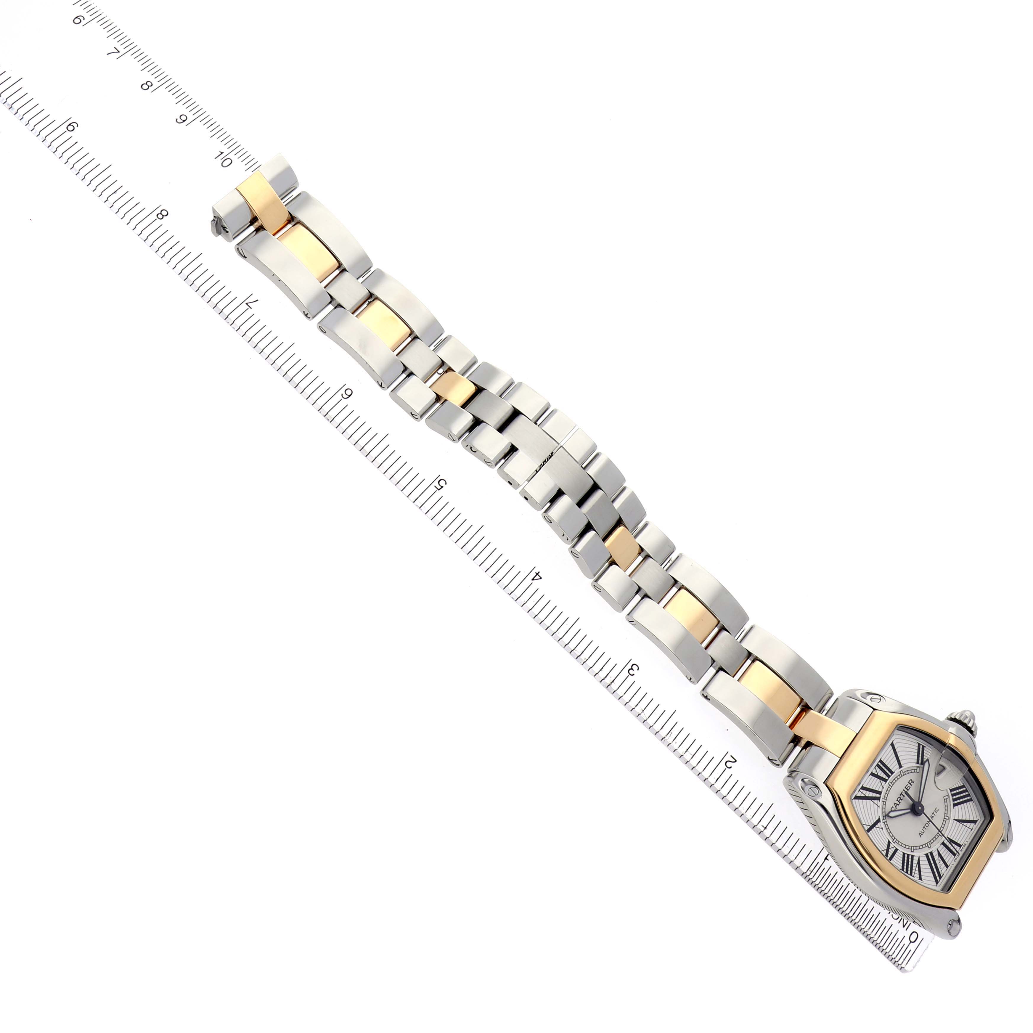 The Cartier Roadster W62031Y4 Men
s Steel and Gold (two tone) Silver Dial W62031Y4 Men
s Steel and Gold (two tone) Silver Dial watch is shown from a top-down angle, displaying its face and two-tone bracelet.