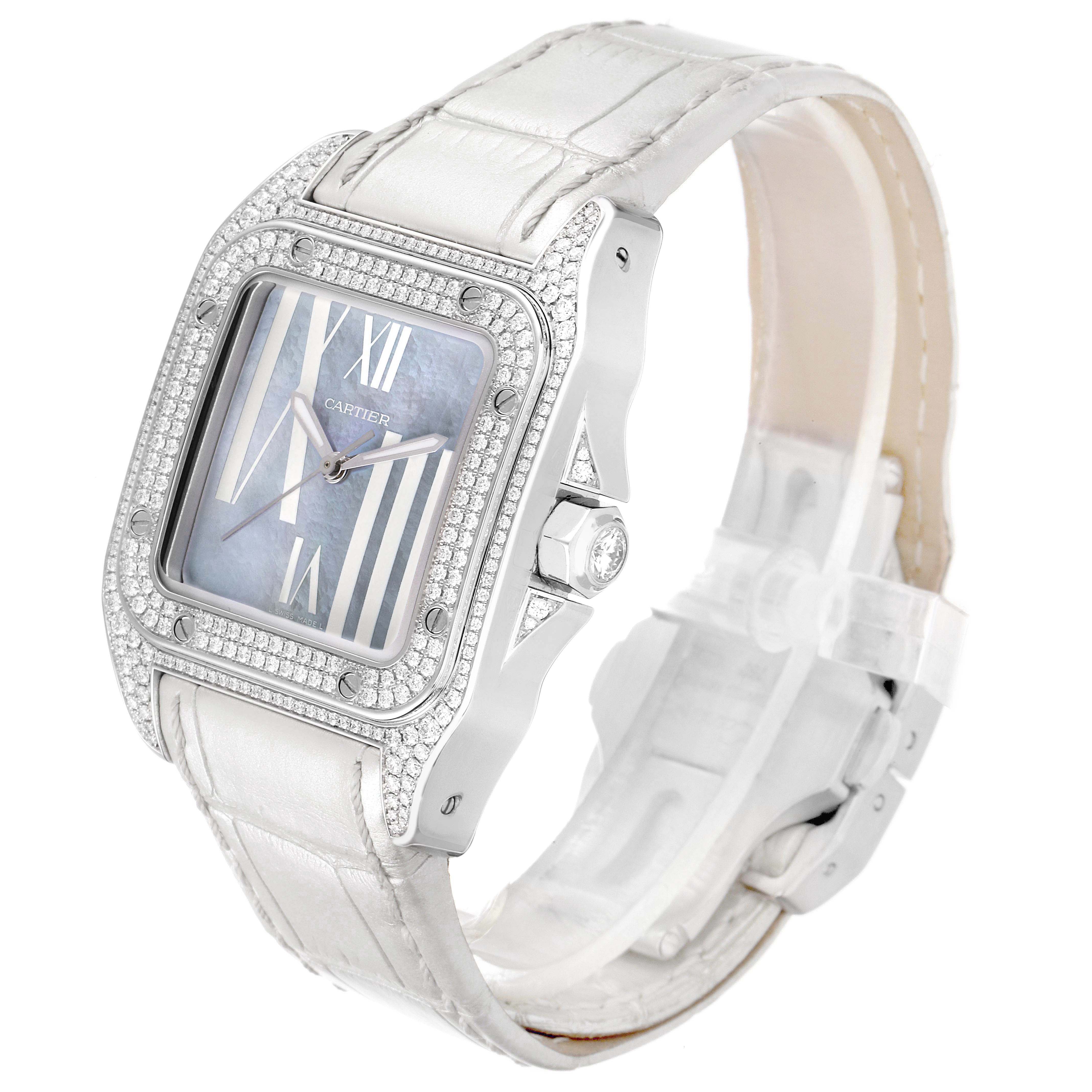 The Cartier Santos WM503251 Women
s White Gold Mother of Pearl Dial WM503251 Women
s White Gold Mother of Pearl Dial watch is shown at a 3/4 angle, highlighting the diamond-encrusted bezel and white strap.