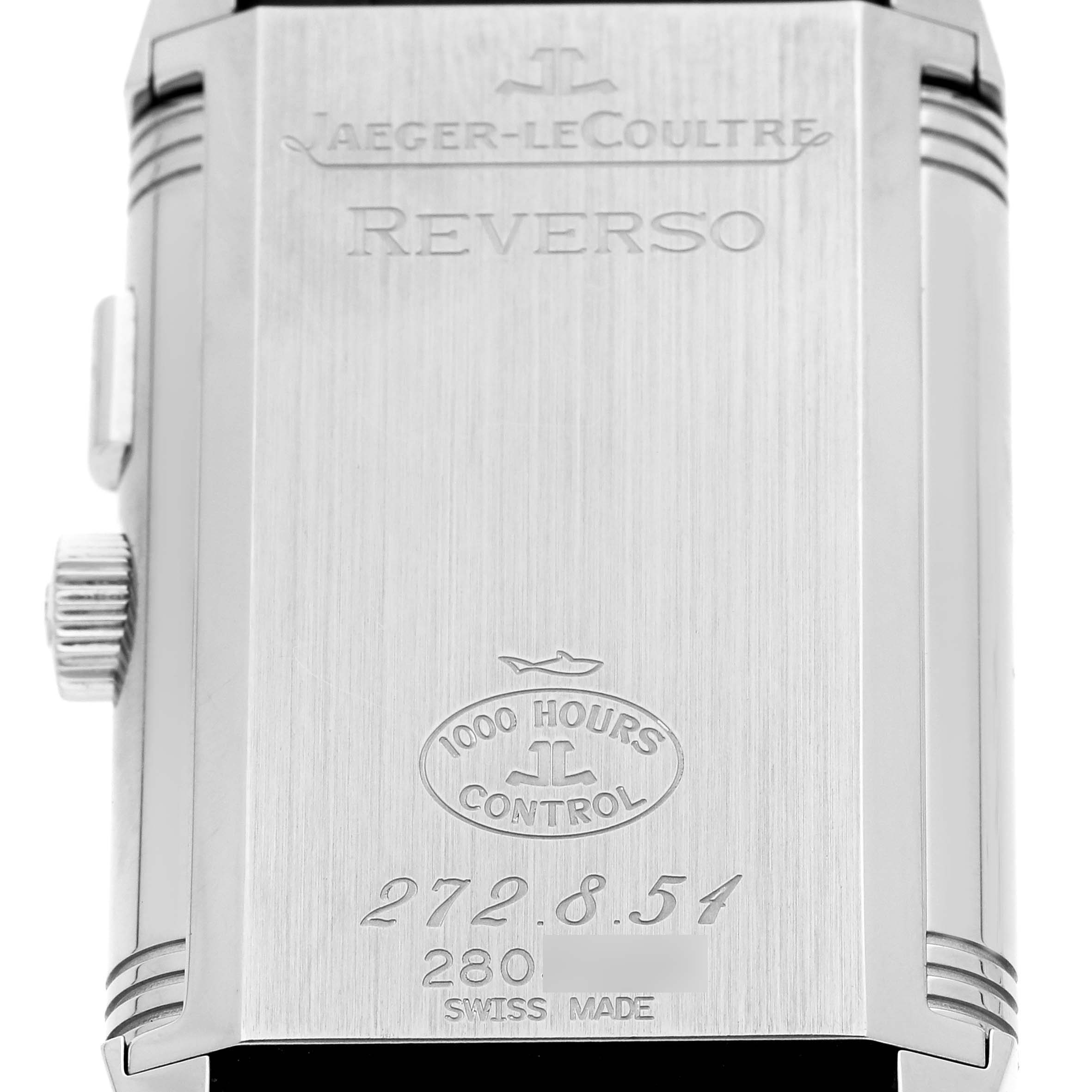 The image shows the back of a Jaeger-LeCoultre Reverso watch, highlighting its engravings and details.