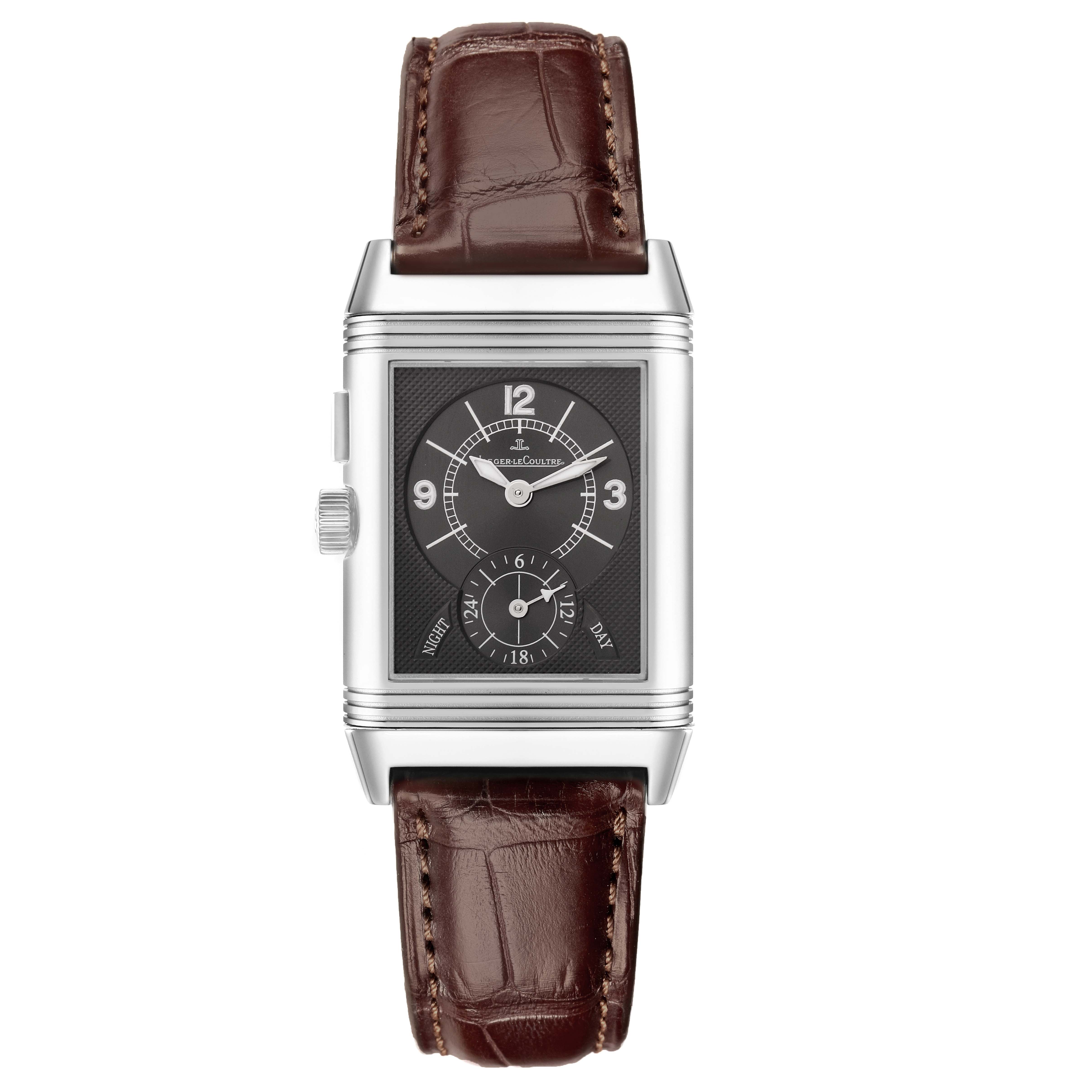 The Jaeger-LeCoultre Reverso watch is shown from a front angle, displaying the dial, case, and brown leather strap.