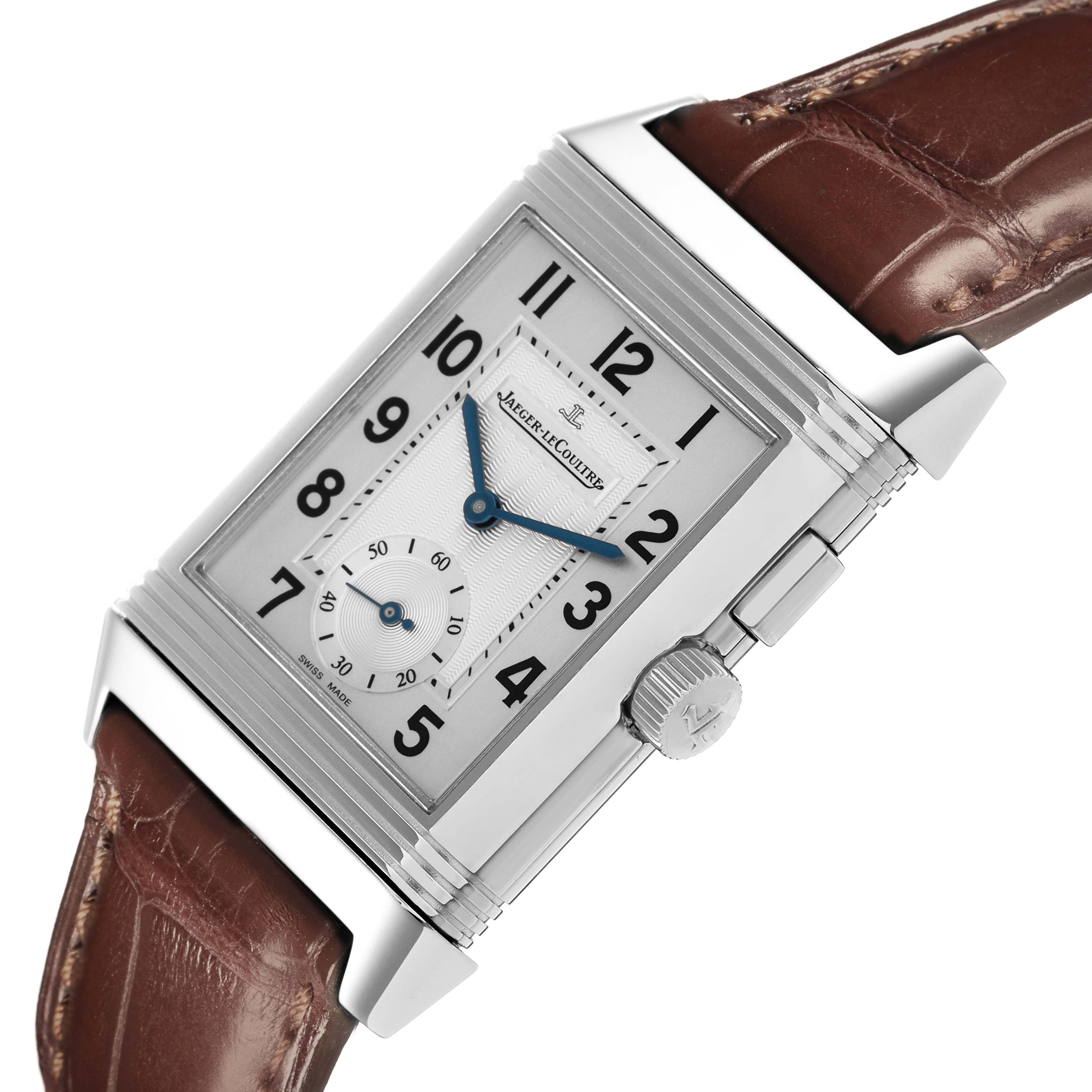 The Jaeger-LeCoultre Reverso watch is shown at a side angle, highlighting its case, dial, and crown, with a brown leather strap.