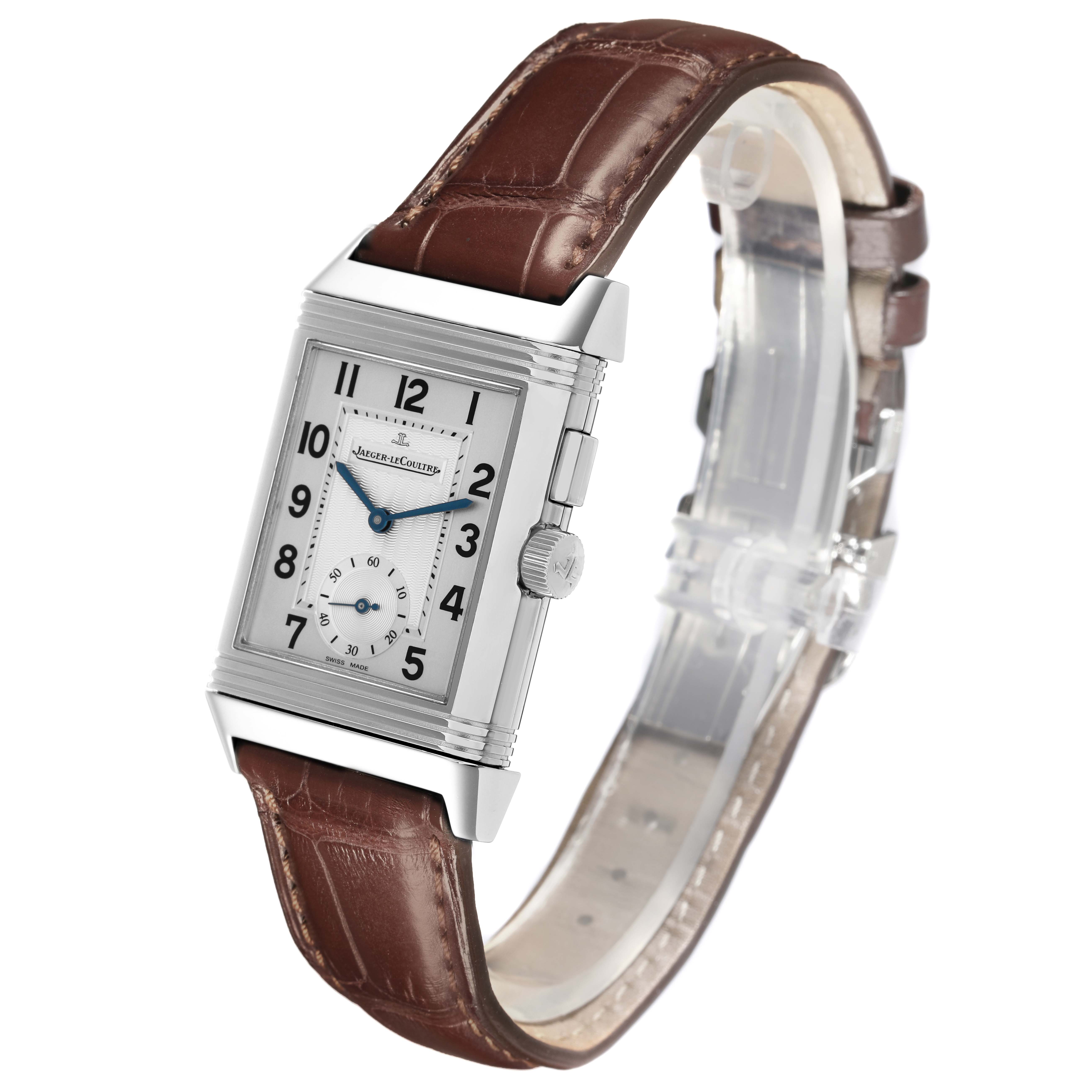 This image shows a Jaeger-LeCoultre Reverso watch at a tilted angle, highlighting the rectangular case, dial, and leather strap.