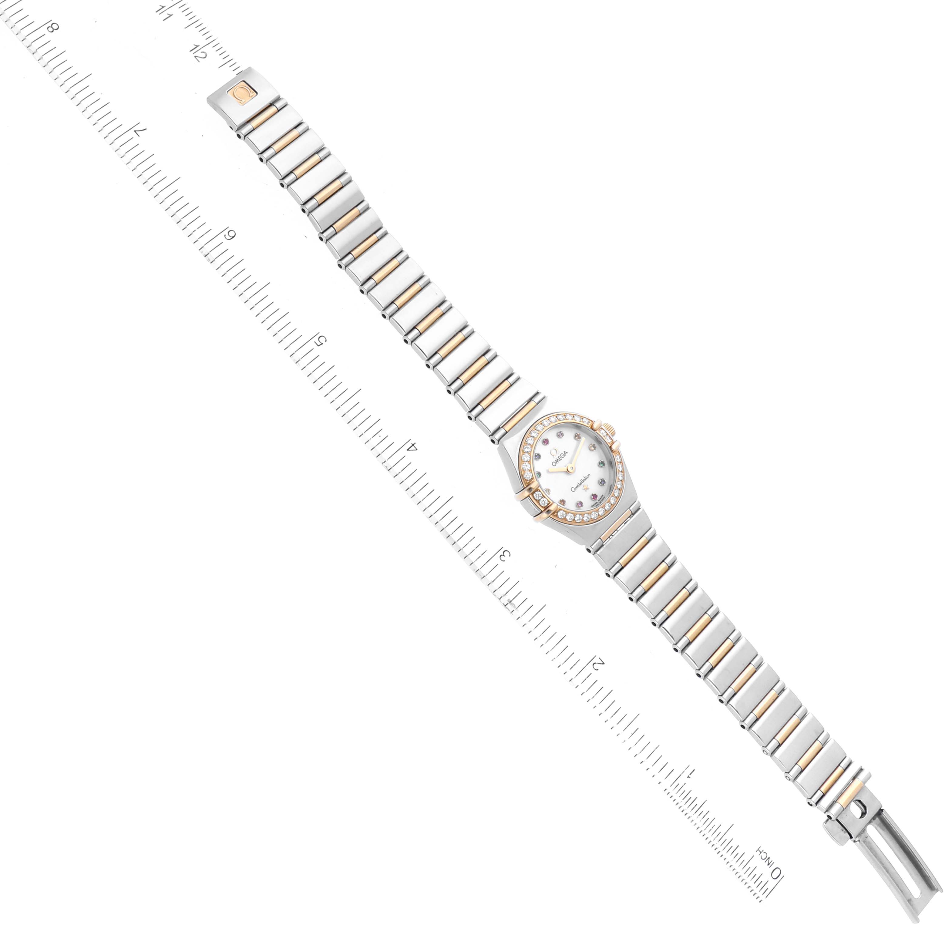 The Omega 1365.79.00 Women's Steel and Gold (two tone) Mother of Pearl Dial 1365.79.00 Women's Steel and Gold (two tone) Mother of Pearl Dial Constellation Iris Rainbow Steel Yellow Gold Multi Stone Ladies Watch 1365.79.00 is shown from a top-down perspective, including the full band and face.