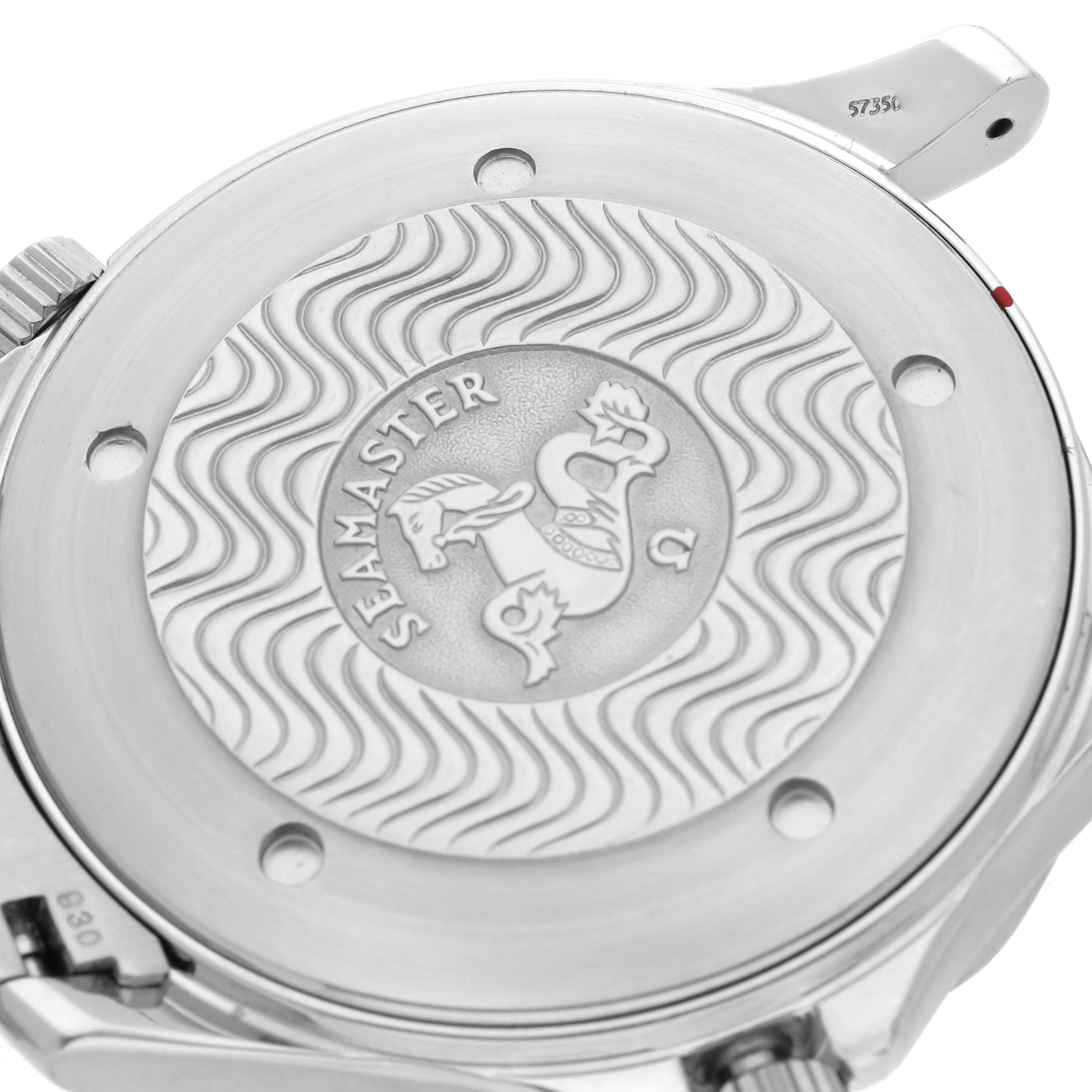 The image shows the case back of an Omega Seamaster 2264.50.00 Men
s Stainless Steel Black Dial 2264.50.00 Men
s Stainless Steel Black Dial, featuring its embossed emblem and wave pattern, viewed from above.