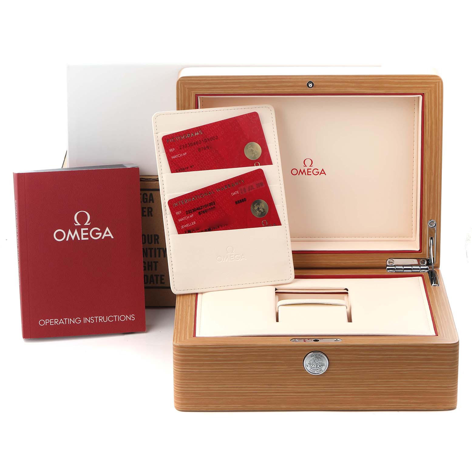 The image shows an Omega Planet Ocean 232.30.46.21.01.002 Men
s Stainless Steel Black Dial 232.30.46.21.01.002 Men
s Stainless Steel Black Dial watch box with warranty cards and an instruction booklet at an angle.