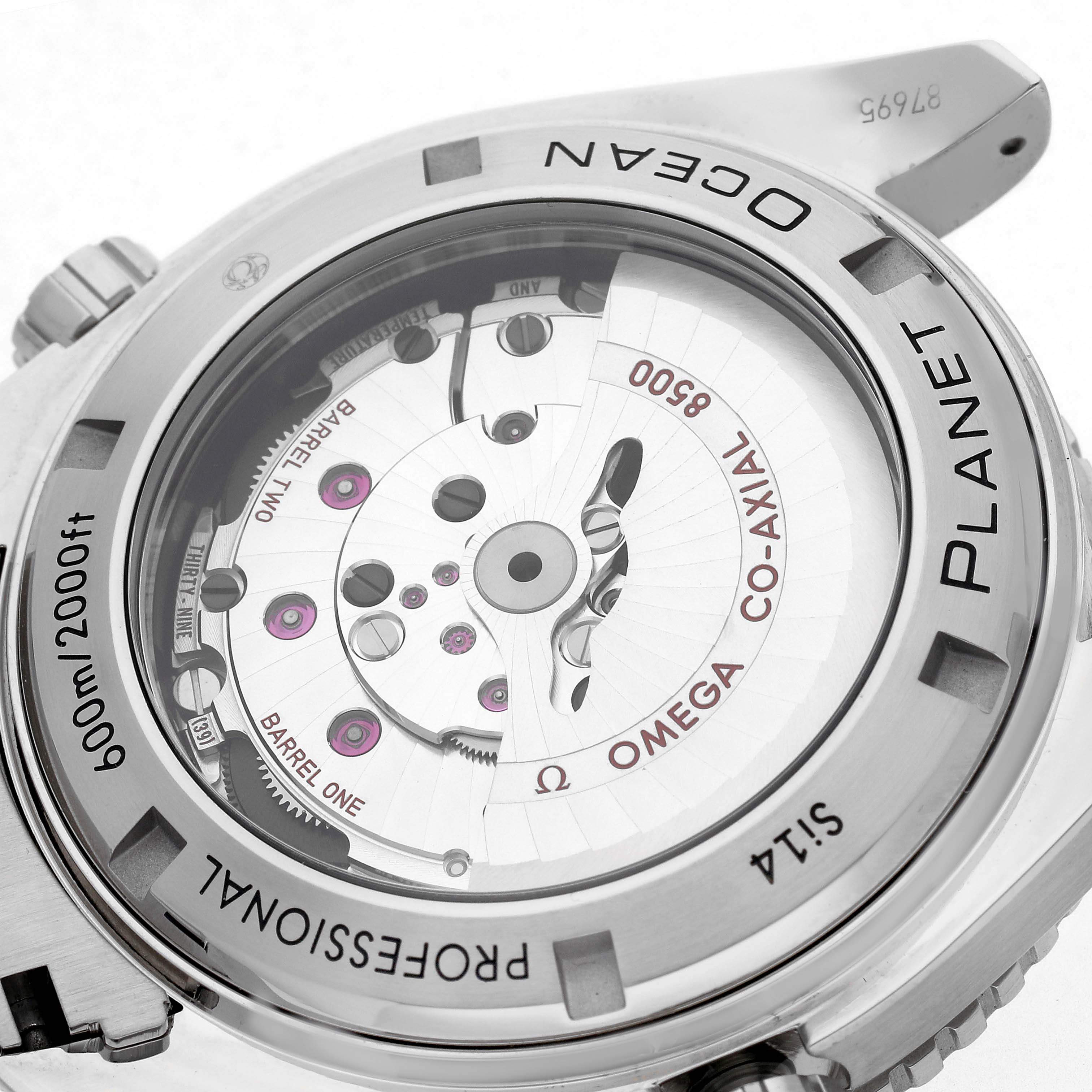 The image shows the back of the Omega Planet Ocean 232.30.46.21.01.002 Men
s Stainless Steel Black Dial 232.30.46.21.01.002 Men
s Stainless Steel Black Dial watch, highlighting its Co-Axial movement mechanism.