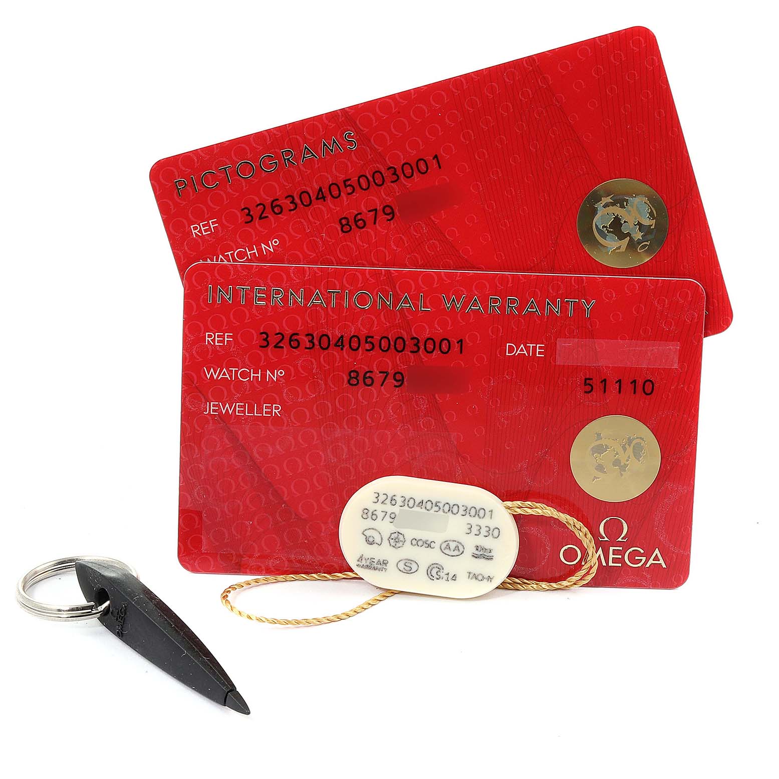 The image shows the pictogram and international warranty cards, along with a tag and tool, for the Omega Speedmaster 326.30.40.50.01.001 Men
s Stainless Steel Blue Dial 326.30.40.50.01.001 Men
s Stainless Steel Blue Dial watch model.