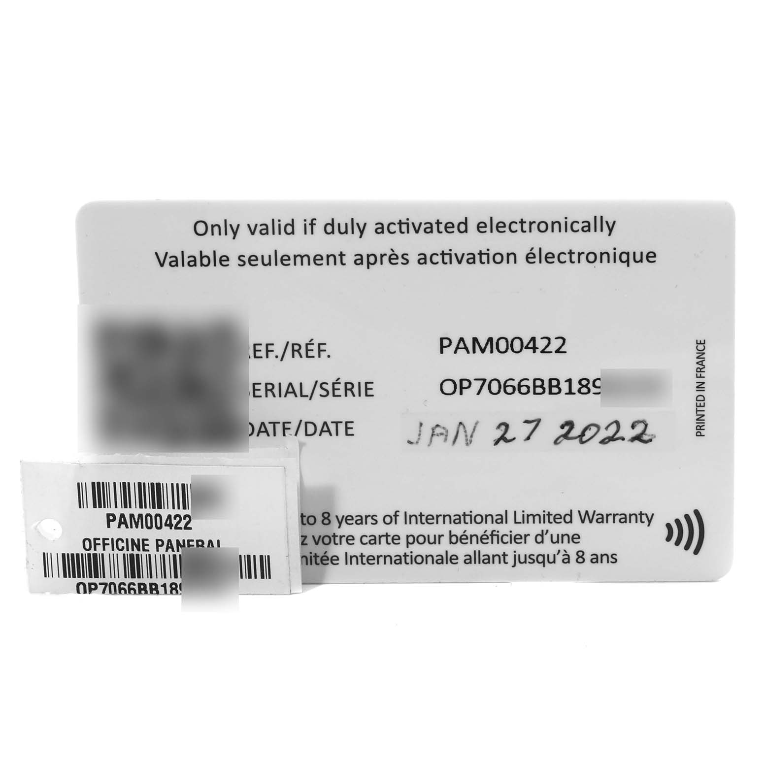 The image shows the warranty card and tags for a Panerai Luminor PAM00422 Men
s Stainless Steel Black Dial PAM00422 Men
s Stainless Steel Black Dial model PAM00422 watch.