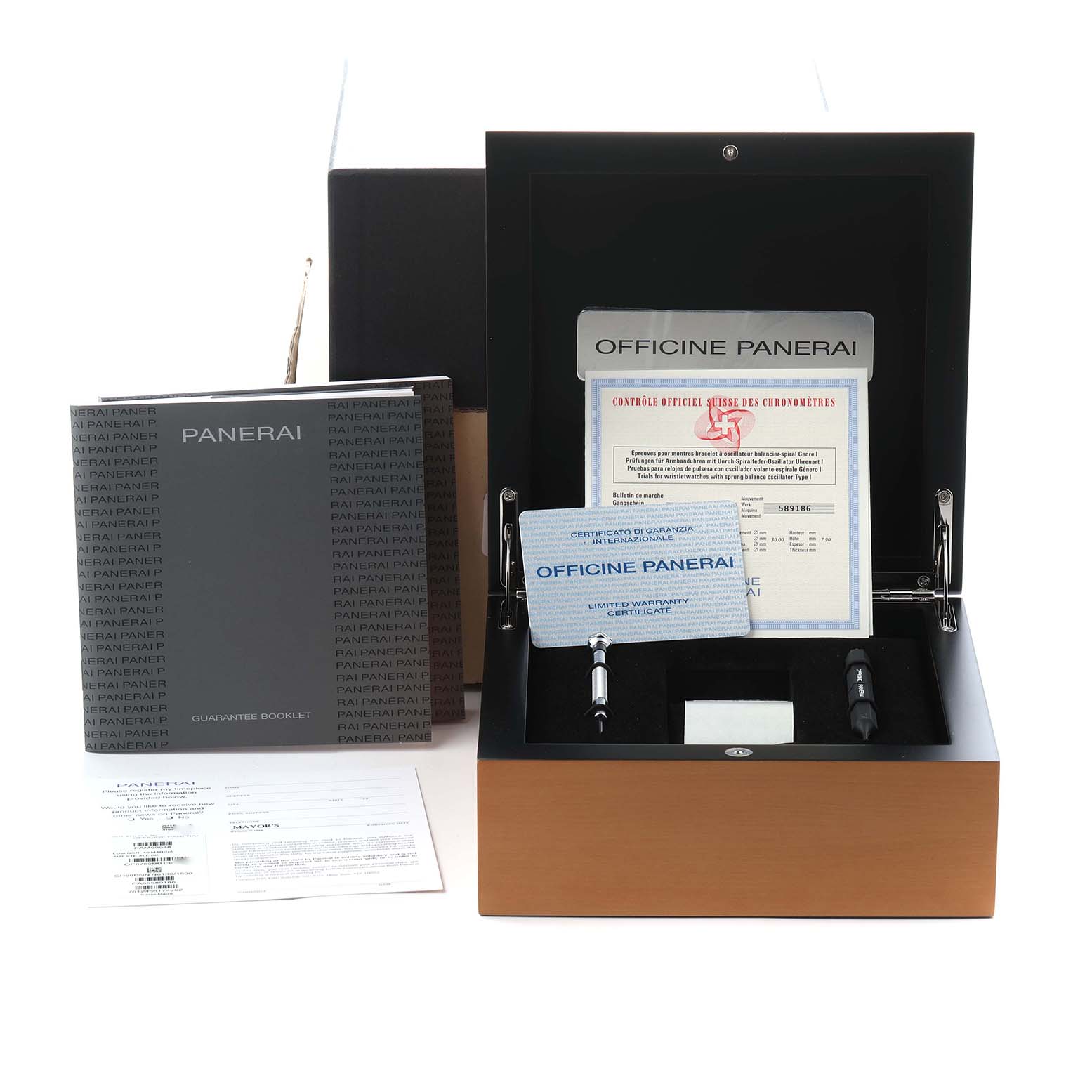 The image shows a Panerai Luminor PAM00048 Men
s Stainless Steel Black Dial PAM00048 Men
s Stainless Steel Black Dial watch box at an angle, including documentation, a warranty card, and tools.