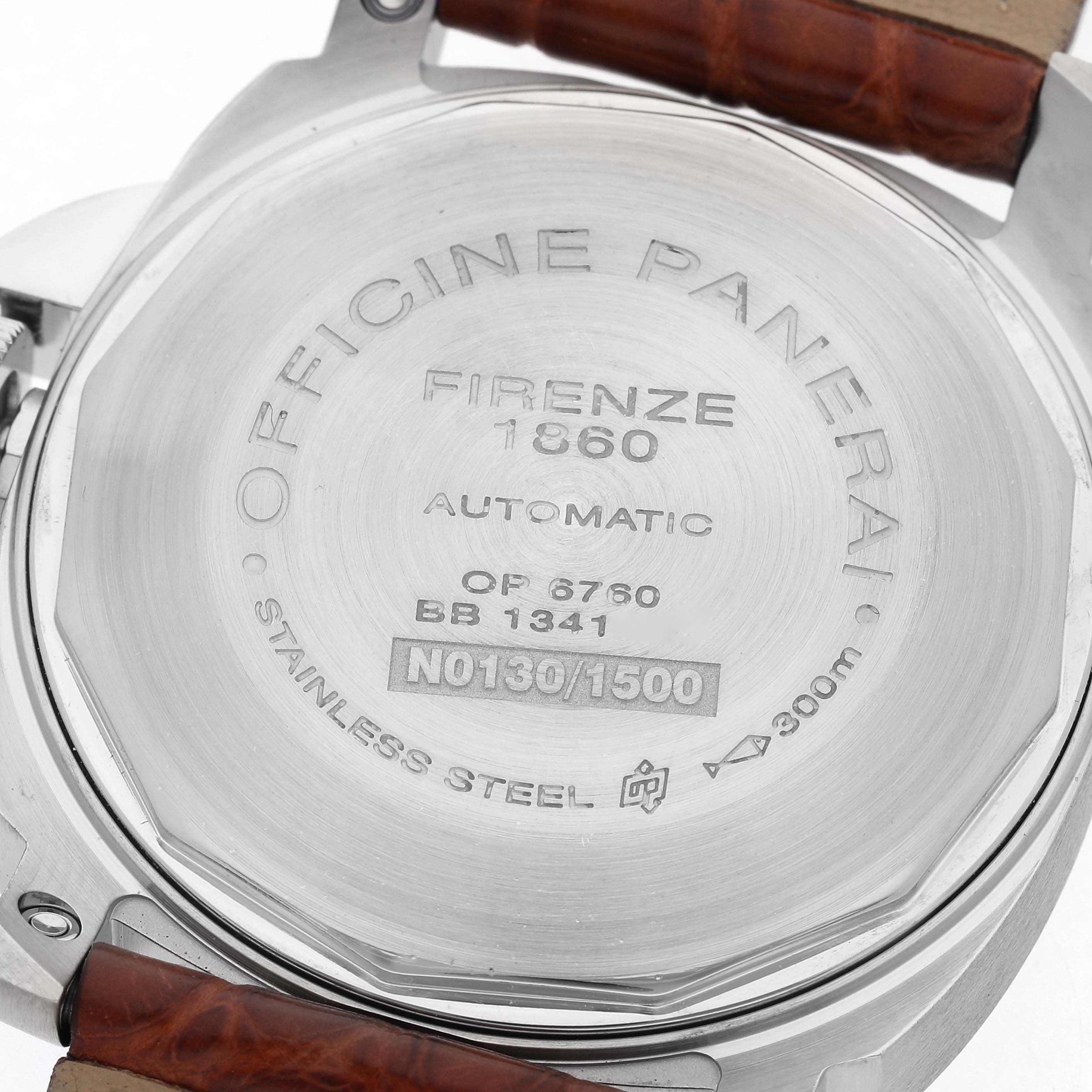 The image shows the back of a Panerai Luminor PAM00048 Men
s Stainless Steel Black Dial PAM00048 Men
s Stainless Steel Black Dial watch, highlighting its engravings and leather strap attachment.