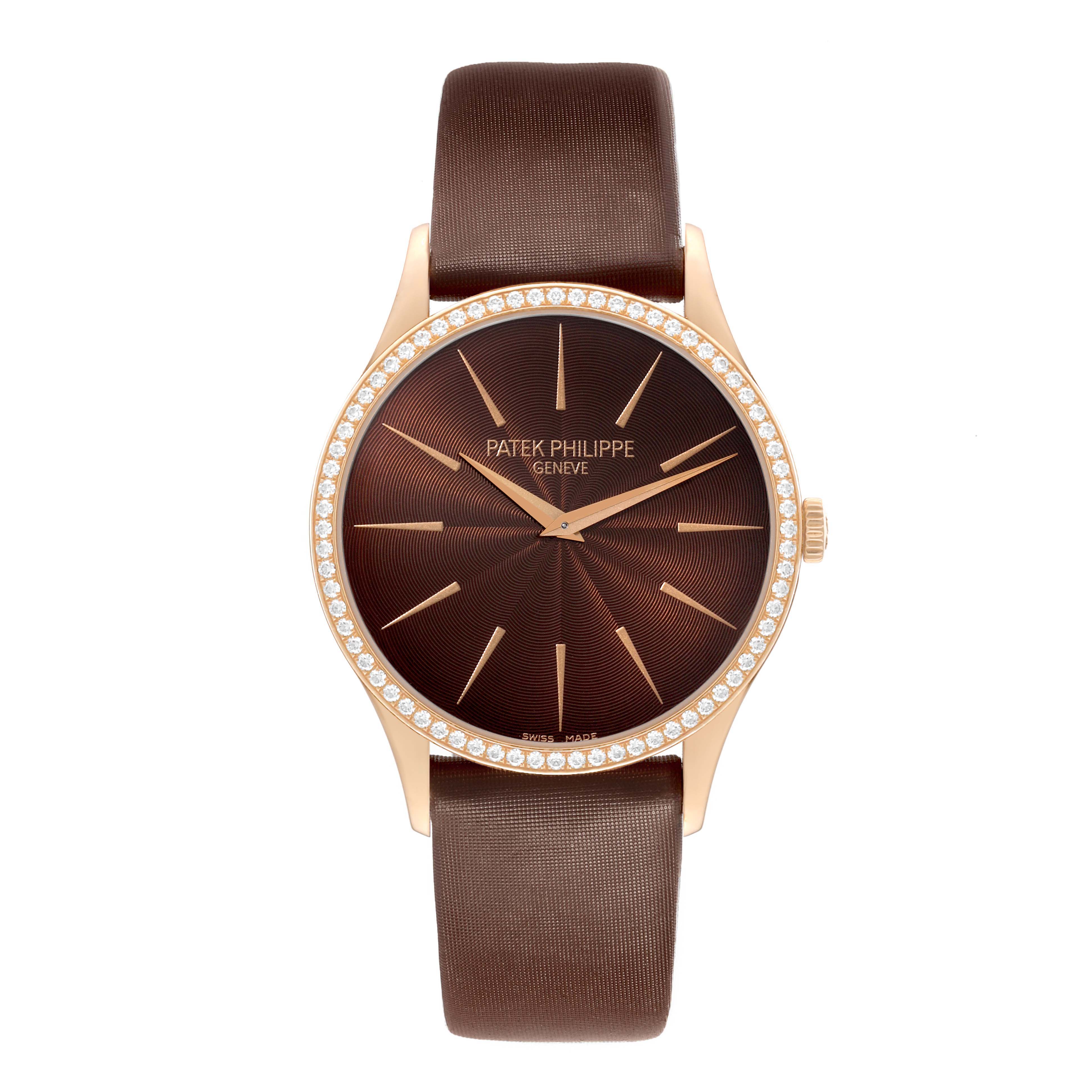 The Patek Philippe Calatrava 4897R-001 Women's Rose Gold Brown Dial watch is shown from a top-down angle, displaying the dial, bezel, and strap.