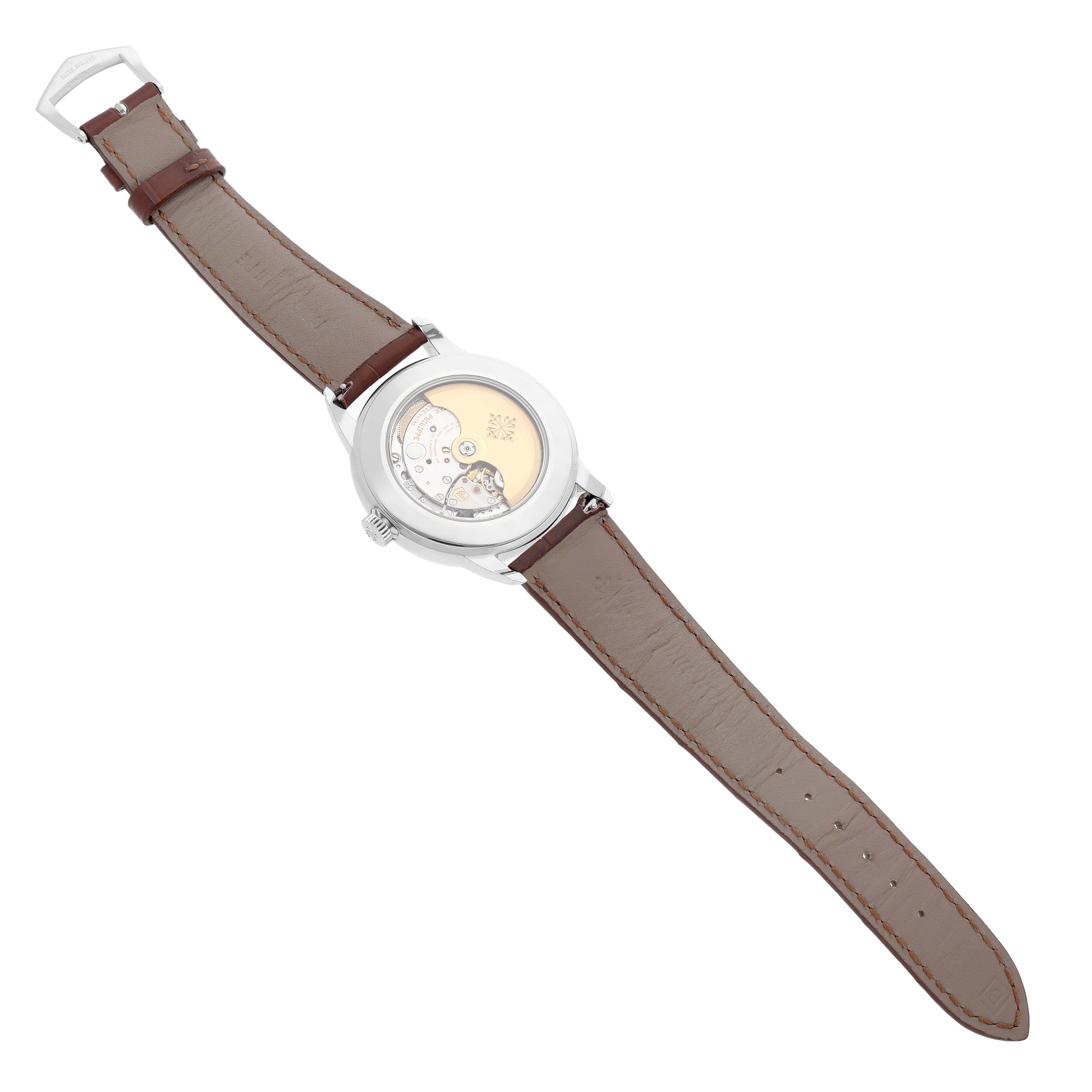 The Patek Philippe Complications 5212A-001 Men's Stainless Steel Silver Dial watch is shown from the back angle, displaying the movement and leather strap.