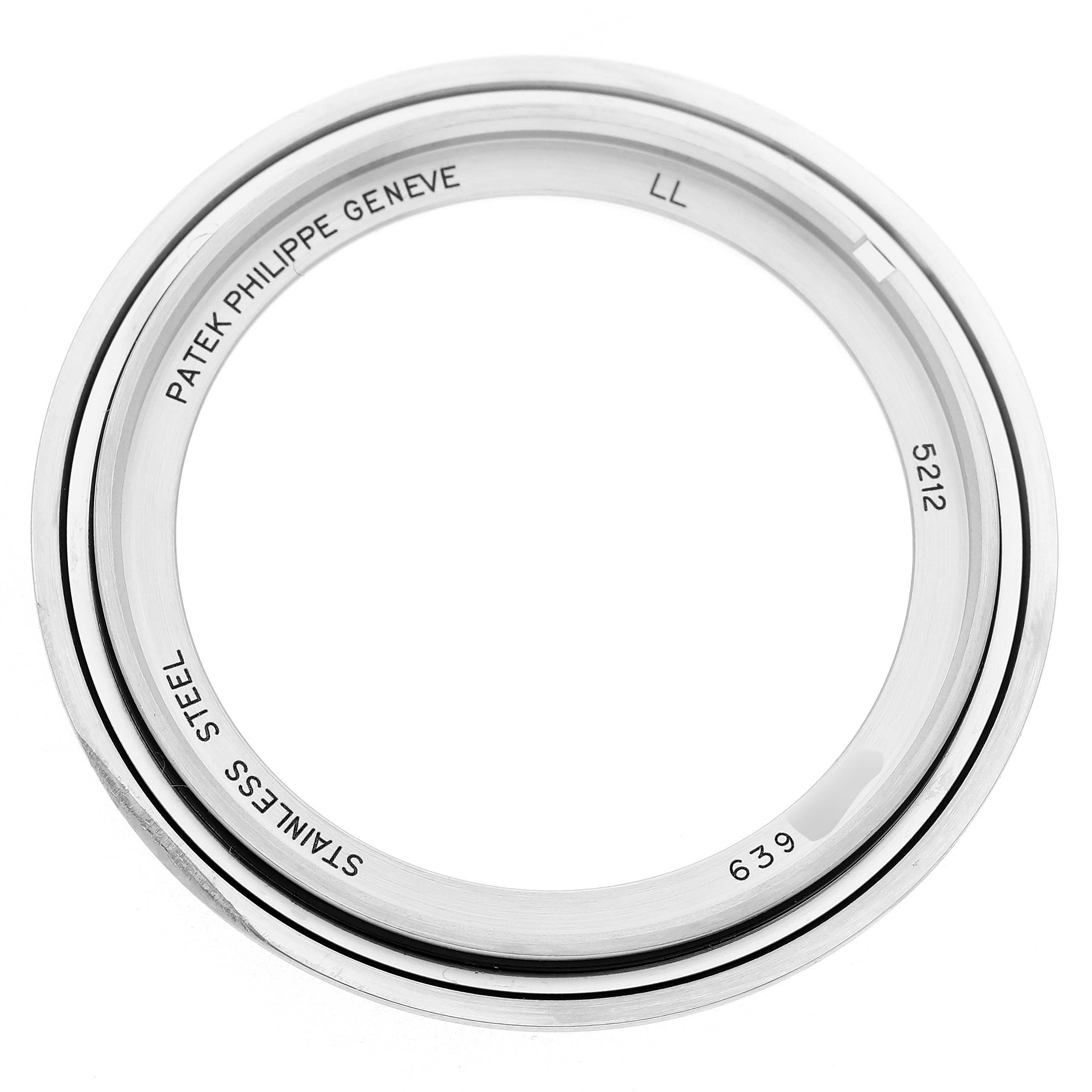 This image shows a top-down view of the stainless steel bezel for a Patek Philippe Complications 5212A-001 Men's Stainless Steel Silver Dial model.