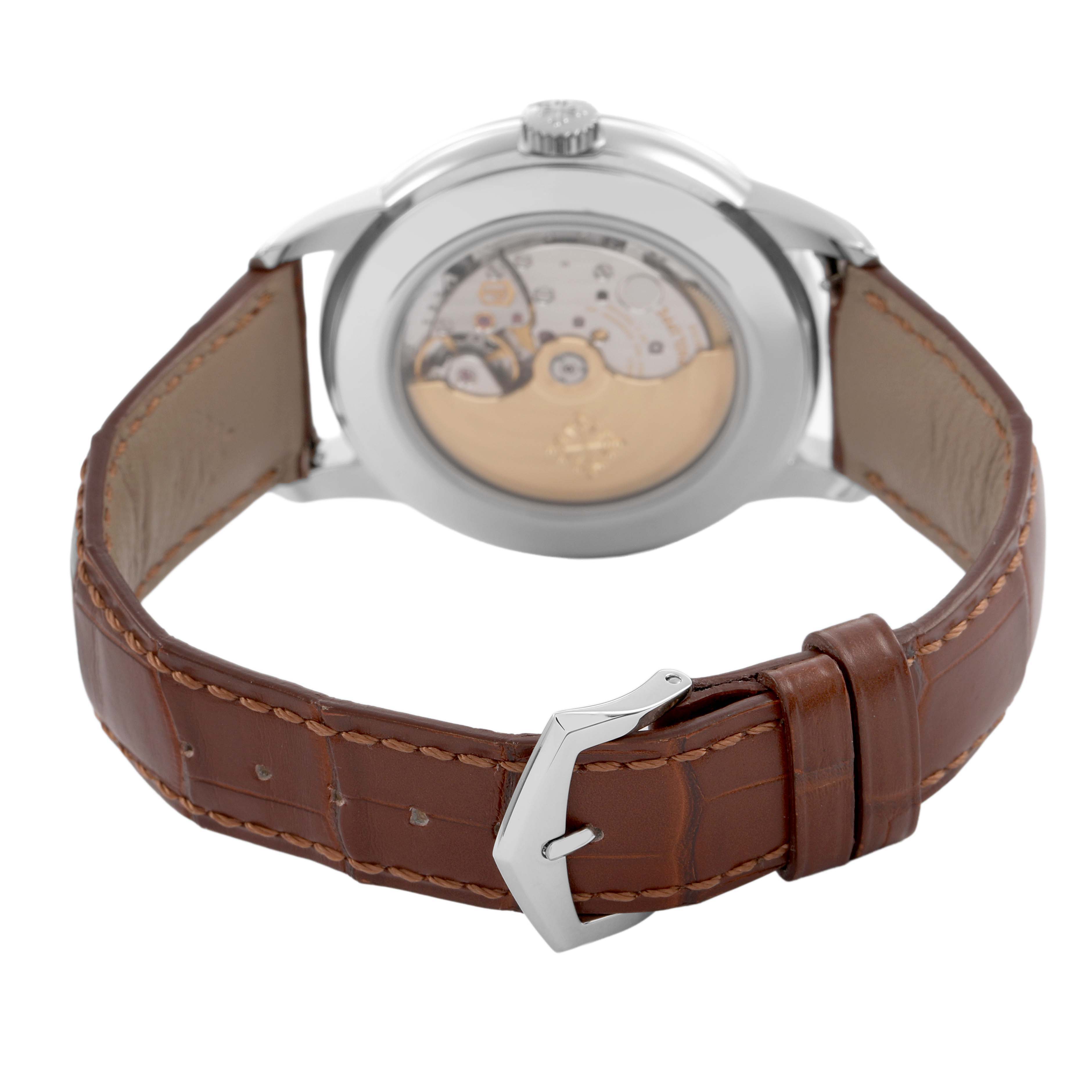 The Patek Philippe Complications 5212A-001 Men's Stainless Steel Silver Dial watch is shown from the back, displaying the movement and brown leather strap with buckle.