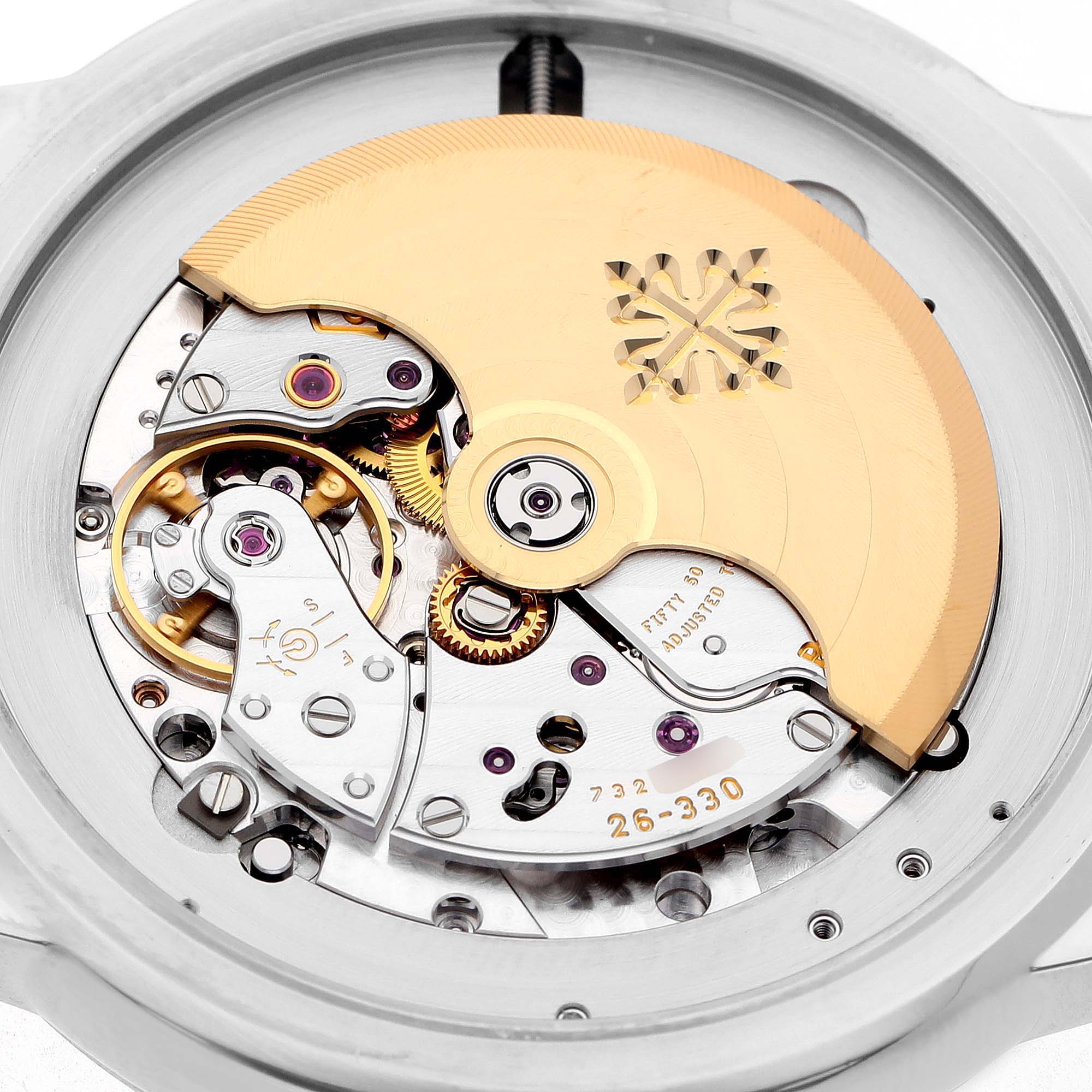 The image shows the movement and rotor of a Patek Philippe Complications 5212A-001 Men's Stainless Steel Silver Dial model, viewed from the back.