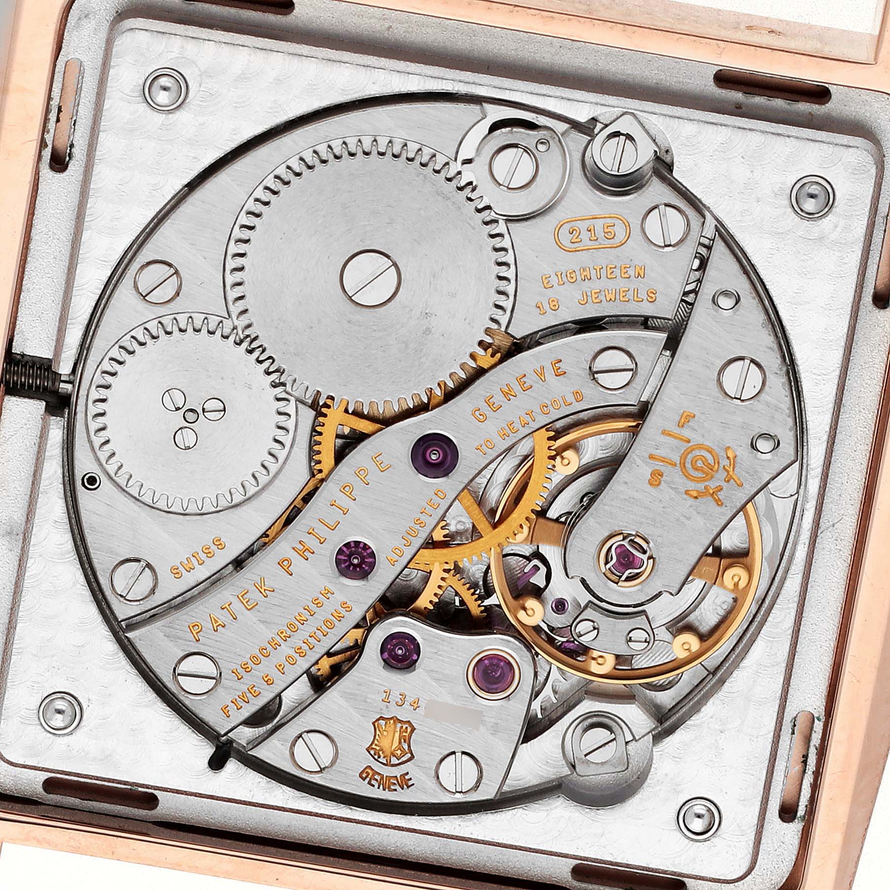 The image shows the intricate back view of the Patek Philippe Gondolo 5489R Men
s Rose Gold Silver Dial 5489R Men
s Rose Gold Silver Dial movement, featuring gears and jewels.