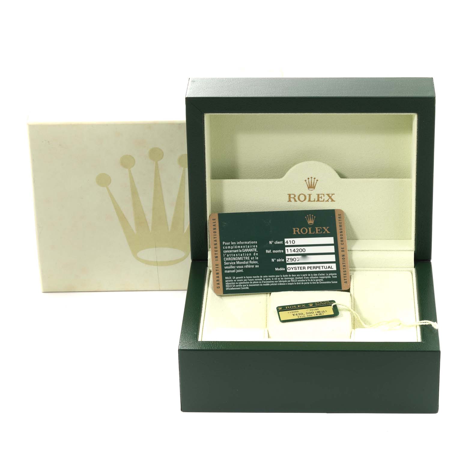 The image shows the packaging, warranty card, and accessories for an Air-King model by Rolex.