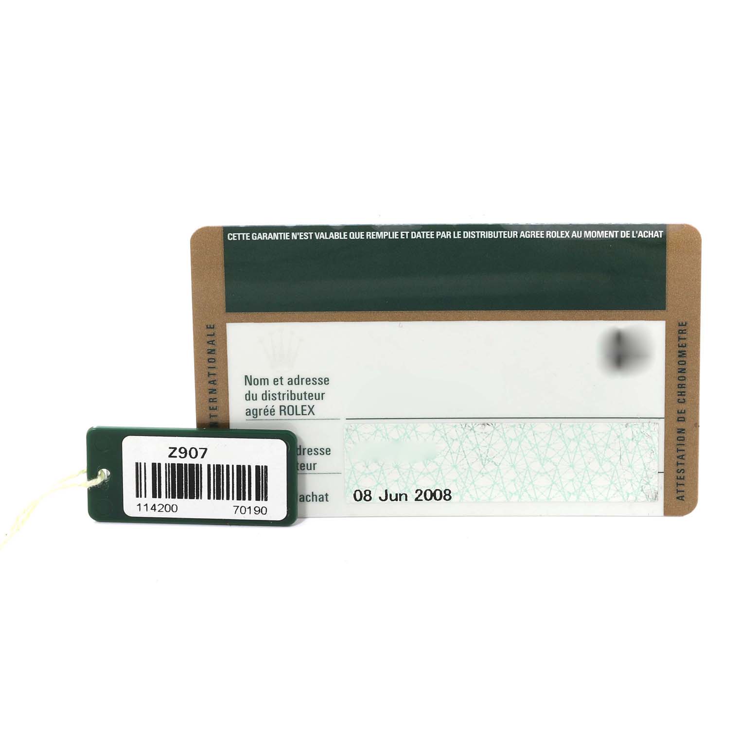 This image shows a warranty card and a barcode tag for the Rolex Air-King 114200 Men's Stainless Steel Grey Dial 114200 Men's Stainless Steel Grey Dial model.