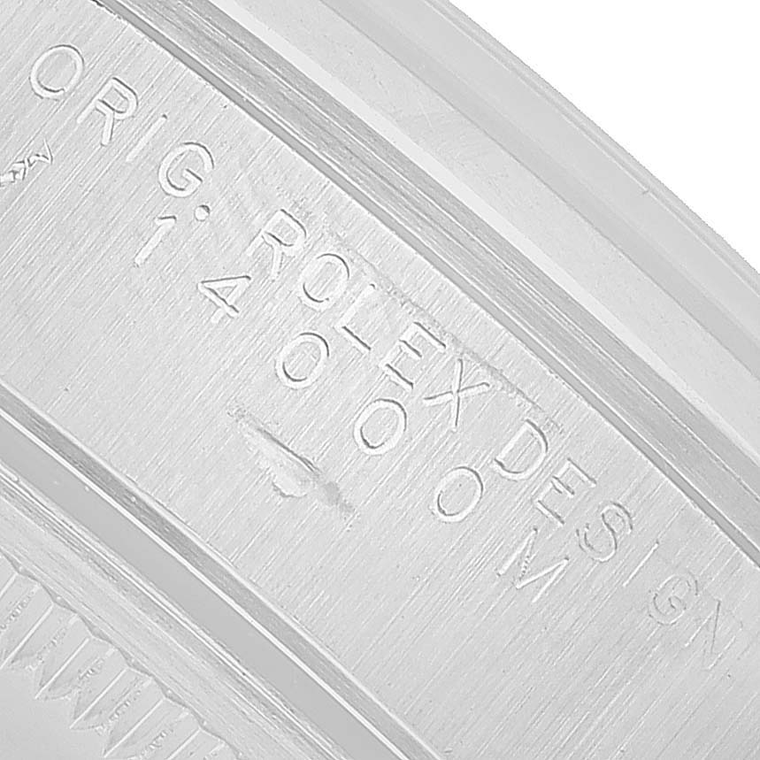 The image shows a close-up of the engravings on the inner bezel of a Rolex Air-King 14000 Men's Stainless Steel Silver Dial watch, displaying the model number.
