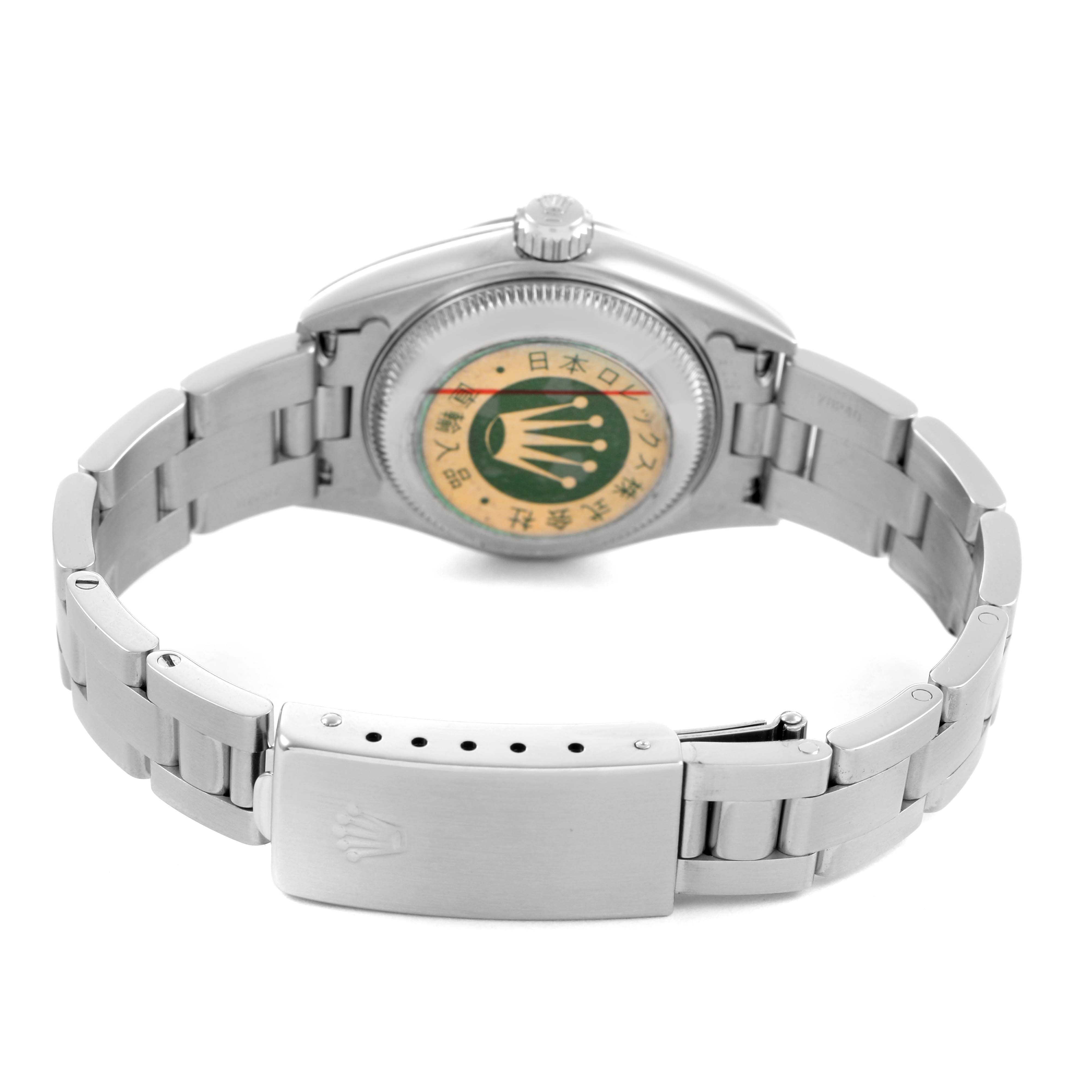 The image shows the back of a Rolex Date 79160 Women's Stainless Steel Blue Dial model, highlighting the case back and bracelet clasp.