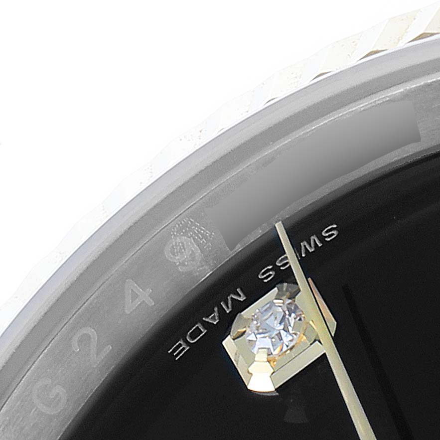 The close-up image shows the bezel, part of the dial, and the "Swiss Made" text on a Rolex Datejust 116233 Men
s Steel and Gold (two tone) Black Dial 116233 Men
s Steel and Gold (two tone) Black Dial watch.
