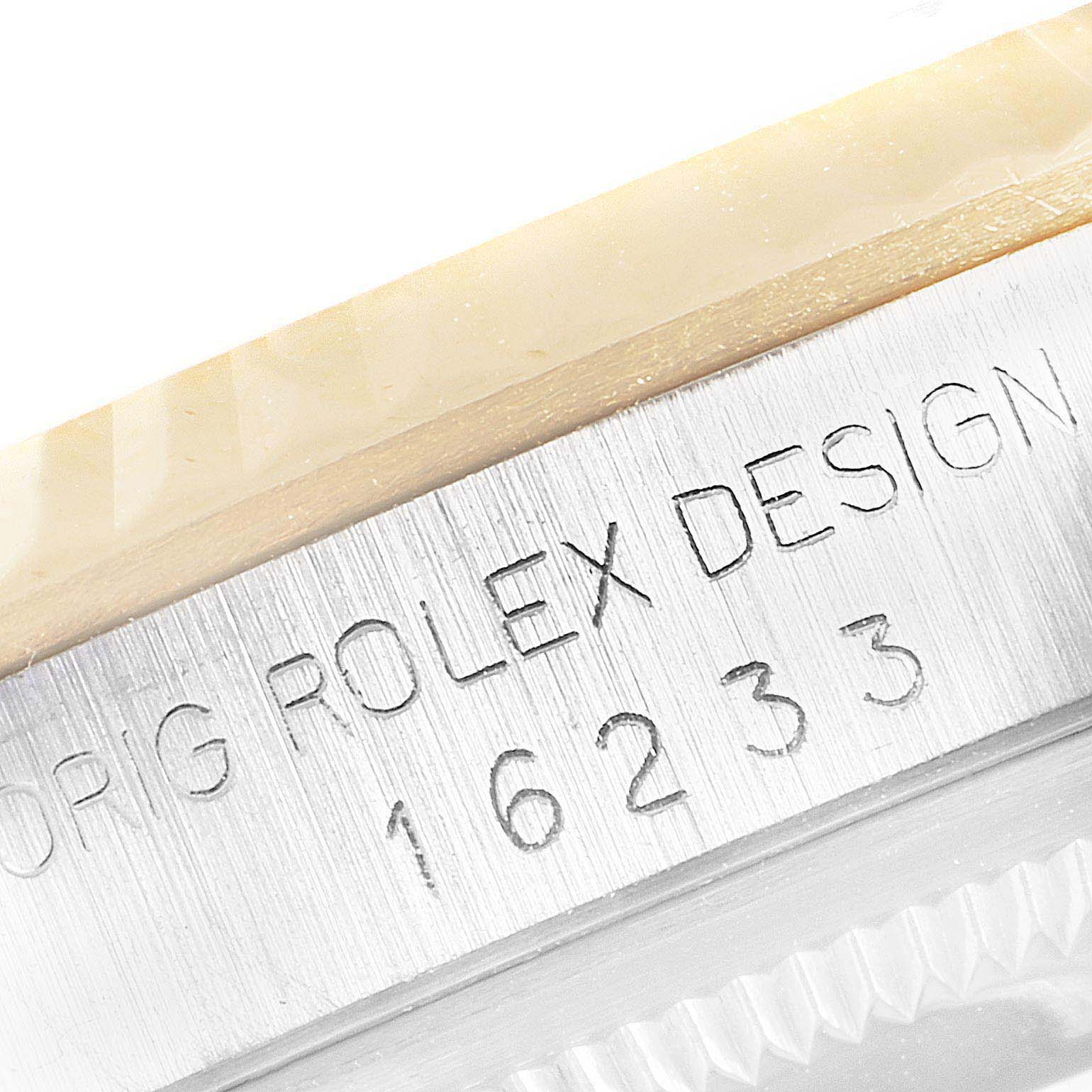 The image shows a close-up of the side of a Rolex Datejust 16233 Men
s Steel and Gold (two tone) Black Dial 16233 Men
s Steel and Gold (two tone) Black Dial watch case with the model number 16233 engraved.