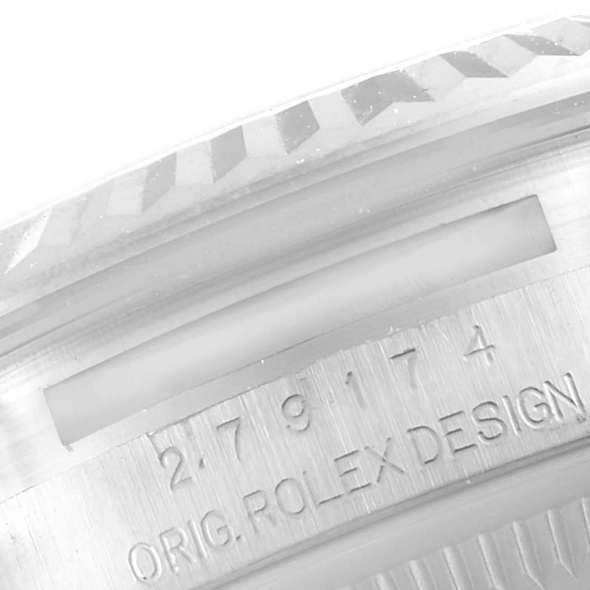 This close-up image shows the serial numbers and "Orig Rolex Design" text on the side of the bezel of a Rolex Datejust 279174 Women
s Stainless Steel Mother of Pearl Dial 279174 Women
s Stainless Steel Mother of Pearl Dial model.
