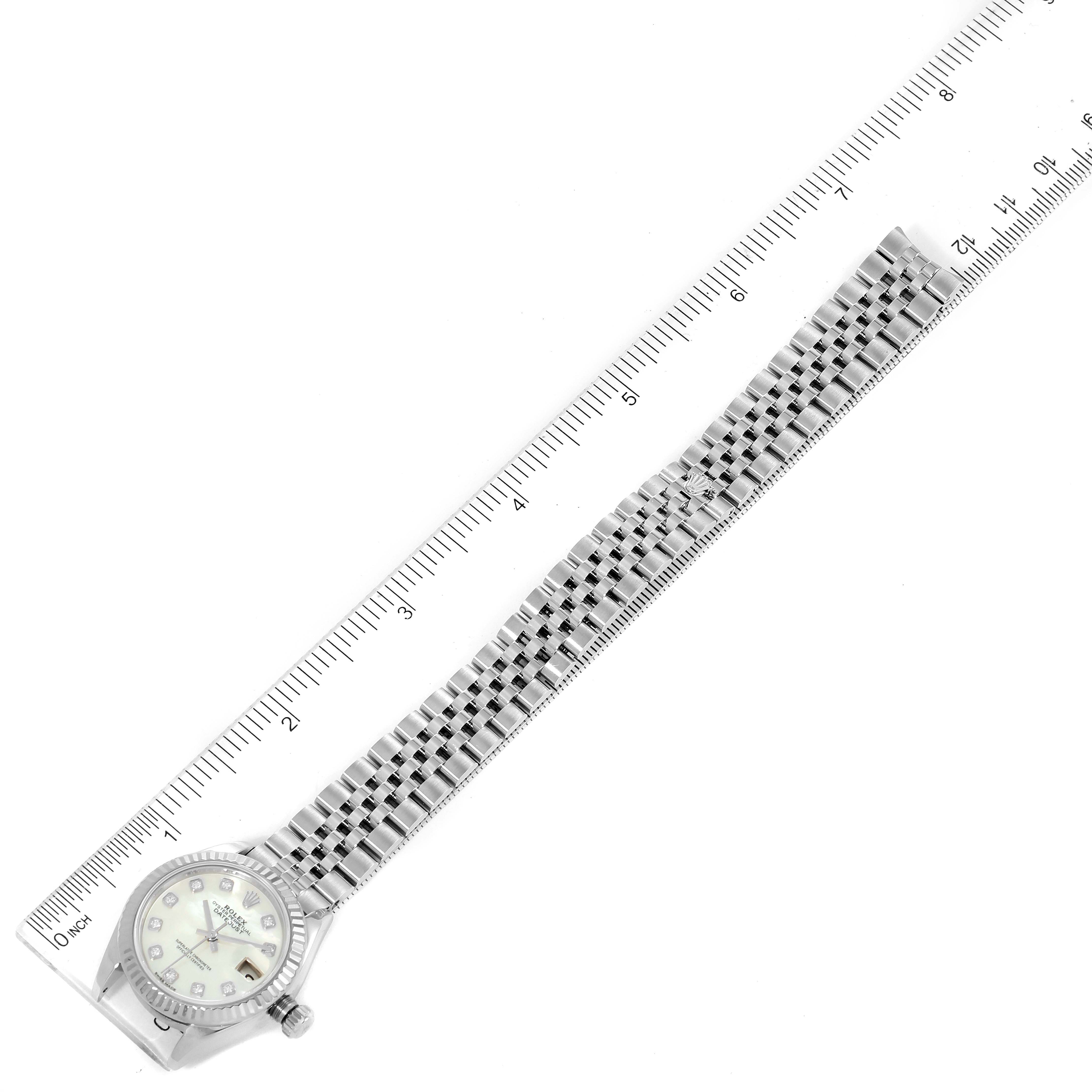 The image shows a top-down view of a Rolex Datejust 279174 Women
s Stainless Steel Mother of Pearl Dial 279174 Women
s Stainless Steel Mother of Pearl Dial watch, including the full length of the band and the face marked with a ruler for scale.
